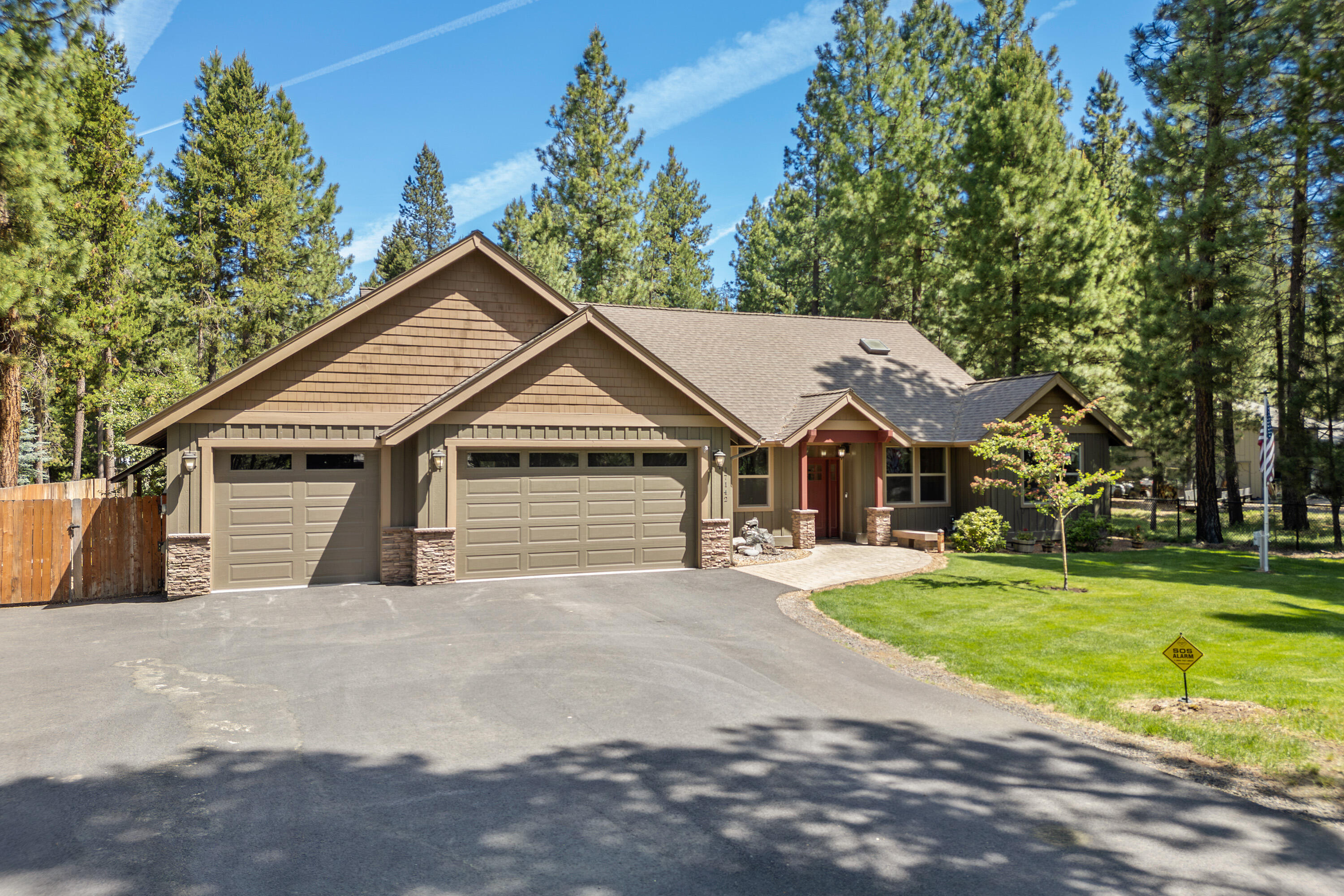 Beautiful home constructed by Pine River offers 3 bedrooms and 2 full baths, plus a spacious office that can be another bedroom. Open floorplan with vaulted ceilings, skylights, and large windows for abundant natural light. Welcoming living area with stunning stone stacked gas fireplace and built-ins. New commercial grade laminate flooring throughout most of the home with travertine tile in the bathrooms and laundry. Open kitchen with quality finishes like granite countertops and stainless-steel appliances. Large primary suite opens to a covered patio with a hot tub—your private retreat. Fully fenced & landscaped front and backyard with in-ground sprinklers, outdoor firepit, and tranquil fountains. Spacious 3-car garage includes a dedicated storage or project room. Paved driveway with RV parking and hookups. Don't miss this beautiful, move-in ready property in the desirable community minutes outside Sunriver and quick access to Mt Bachelor.