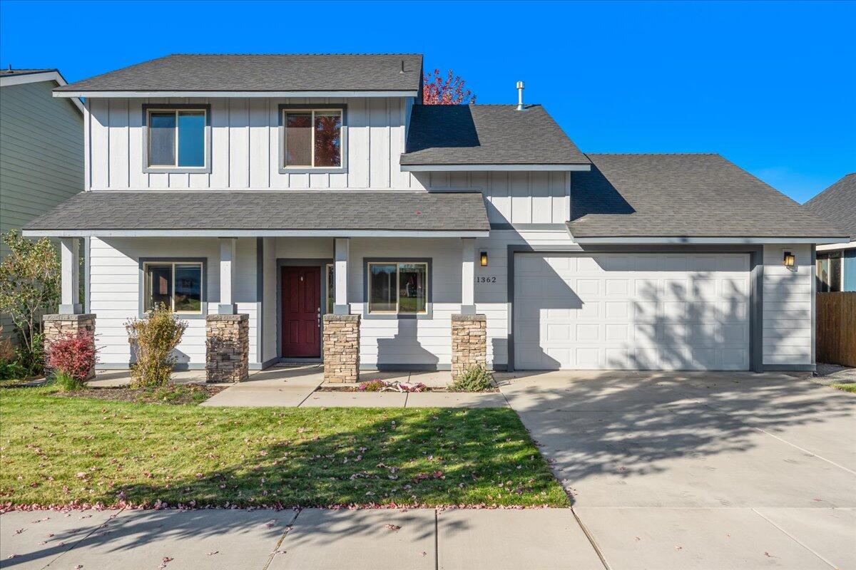 Adorable NE Bend home perfectly located near restaurants, shops, and all the conveniences of town. Enjoy mature landscaping and easy living with the primary suite on the main level. The open floor plan features a cozy gas fireplace with stacked rock surround, wood-simulated vinyl plank flooring, and plenty of natural light. The kitchen shines with custom cabinets, a tile backsplash, and stainless steel appliances. Spacious primary suite includes dual vanities and a walk-in closet. Upstairs offers two bedrooms plus a versatile loft/bonus room. Recent updates include all new carpet and  there is A/C for year-round comfort. Outside, the fully fenced yard and lush landscaping provide privacy, backing up to a landscape nursery with serene views. This well-maintained, move-in ready home offers both comfort and style in an ideal location.