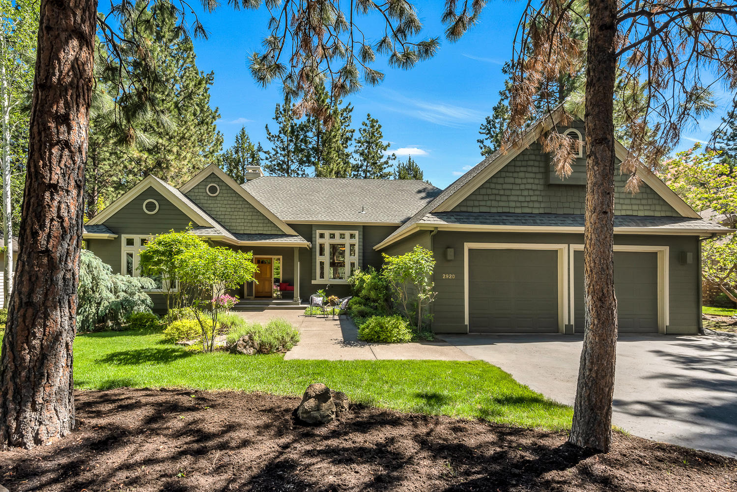 Peaceful sanctuary.  Rejuvenating retreat.  Welcoming private hideaway surrounded by nature, yet close to all of Bend's essential amenities.  This custom Awbrey Glen home is a one-of-a-kind haven in the heart of Bend's Westside.  Towering great room ceilings braced by beautiful exposed rough sawn trusses with windows from floor to ceiling.  The open floor plan brings the outside in with expansive pine forest, green fairway and pond views.  A large center island kitchen with breakfast bar anchors the great room which flows seamlessly to an exceptionally private full-length deck. Expansive primary suite with vaulted ceiling, bay window & direct deck access on one side of the home with full guest wing on the other, featuring large, vaulted bedrooms, full bath, abundant storage & access to the fully covered portion of the deck.  Thoughtfully designed, immaculately maintained, beautifully landscaped, centrally located to all of Bend's westside; your refuge is here.