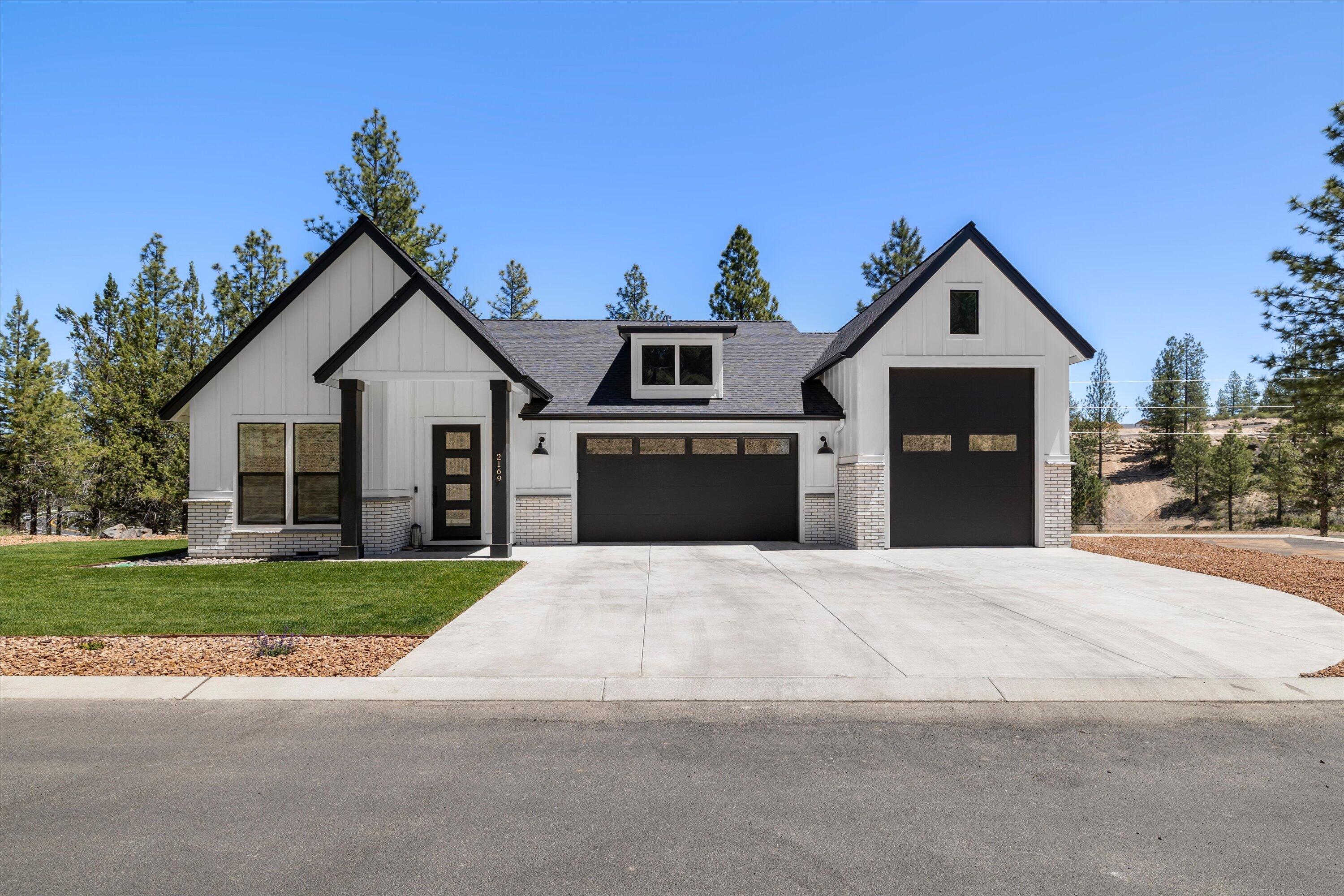 Gorgeous custom home built by Raasch Homes.  This was completed in February of 2024 and was the builder's own residence.  19338 sq ft private lot with plenty of greenspace and walking path access to NW Crossings restaurants and shops.  The open floor plan is full of extensive upgrades.  Dream kitchen with a 9' island, beautiful Cambria counter tops, Professional JennAir appliance package including built in wine refrigerator.  Luxurious master suite with heated tile floors & custom shower.  Great room features built in cabinets and a 4' lineal gas fireplace.  2 zone furnace and AC system for energy efficiency.  Whole house vacuum system.  Large 26'x12' covered 40 yr. warranty Trex deck with black wrought iron railing.  3rd garage bay that measures 13'x32' with full hook ups.  Exterior hot and cold faucet.  Fully landscaped and irrigated. This home is a perfect blend of elegance, function and comfort.