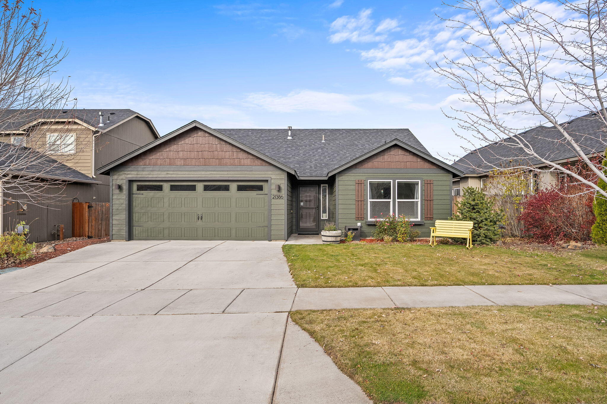 This isn't your cookie-cutter builder-grade home! Thoughtful custom updates and warm design touches make this Eagle Crossing single-level truly stand out. Enjoy an open great room with vaulted ceilings, gas fireplace, and new central A/C for year-round comfort. The kitchen features custom pantry doors, floating shelves, and new stainless-steel appliances, paired with a stylish dining light fixture. The primary suite includes dual closets, ceiling fan, and a fully remodeled bath with double vanity, lighted mirrors, and walk-in shower. Two guest rooms feature unique wall murals, and the laundry boasts a live-edge counter for extra function. Outside, relax on the covered patio overlooking a 20-ft open buffer, surrounded by lush landscaping with sprinklers. Convenient NE Bend location near parks, schools, and shopping—where builder-grade ends and custom comfort begins!