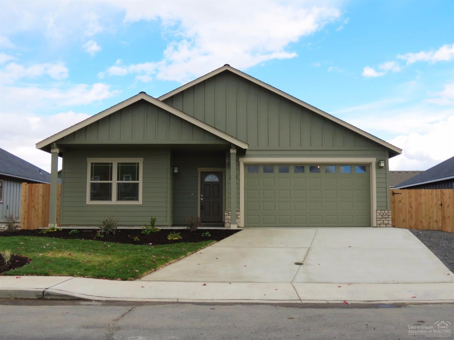 Large great room with gas fireplace opens to dining and kitchen with eating bar. Knotty Alder cabinets with quartz slab counter tops, all stainless appliances. 30 year roof, forced air gas heat with air conditioning. Separate utility room. Double car attached garage that is extra deep. Lots of room for that RV or a shop, this lot is 167 ft deep with access to the back, giving you room for all the outdoor toys. Landscaped front and back sprinkler system. Single level home with great curb appeal.