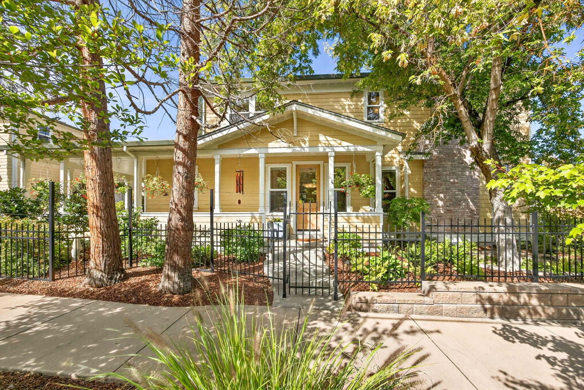 Custom built in 2017 by Agakhanov Homes, this home in Ashland's sought-after Railroad District offers the ideal blend of neighborhood charm & proximity to downtown. The main level features a well-appointed primary suite w/ensuite bath, chef's kitchen, open living & dining areas, powder room, and laundry/mudroom. Upstairs, discover a second primary suite w/ensuite bath, guest suite w/ensuite bath, office, and second laundry. Expansive windows w/Hunter Douglas shades fill the home with natural light while providing privacy. Highlights include Thermador appliances, a gas fireplace, custom built-ins, central vacuum, radiant heat in both primary baths & 3 tankless water heaters. Professionally landscaped, park-like grounds offer privacy and ambiance w/drip irrigation, a wraparound covered porch & outdoor fireplace. Above the detached two-car garage, you'll find a legal ARU with separate address, meter & private entry which includes a kitchen, bath, walk-in closet & private laundry area.