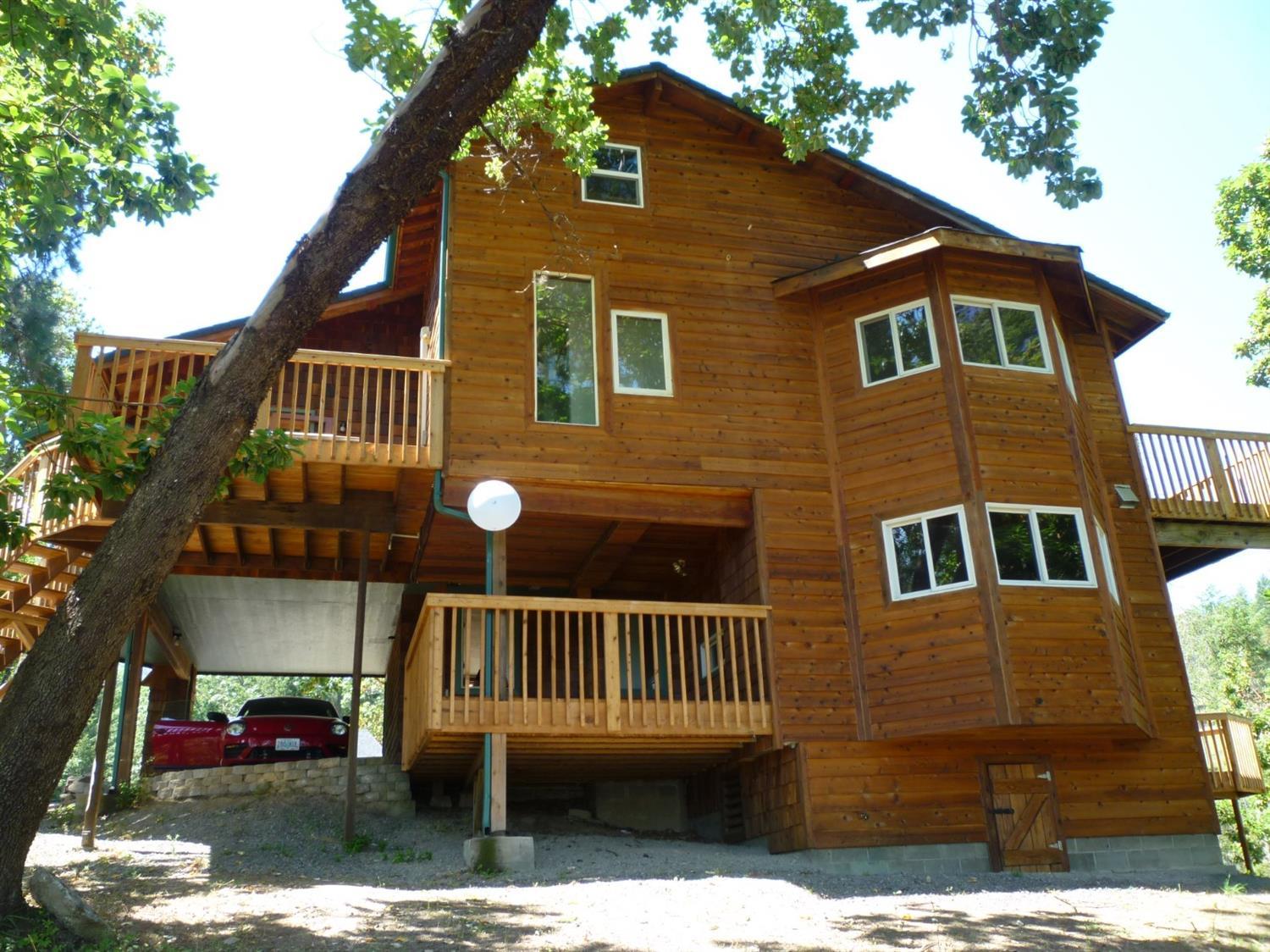 Welcome to your mountain hideaway! Privacy and beautiful views of the valley yet close to town and conveniences are waiting for you!. This home has been wonderfully updated and is ready to be yours! Five bedrooms and 3 baths from bottom to top in this unique tri-level floor plan, large all wood spiral staircase takes you to the expansive master bedroom with walk in closet and private deck overlooking the valley. Indoor pool with French doors entry from the family room will create great family fun all the year round! Very nice wide plank wood flooring in the living, dining, and kitchen areas. New appliances in the kitchen. Make your appointment today to view this special home. One year home warranty included.