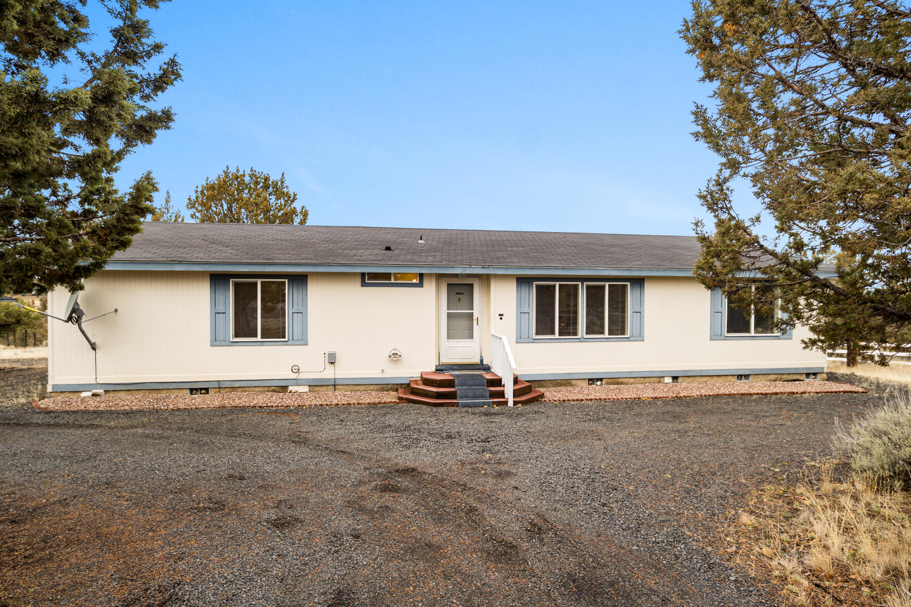 Come tour this well maintained manufactured home on 2  acres in the desirable High Desert Estates of Prineville, Oregon. Offering  views of the Cascade Mountains, including Mount Jefferson and the North Sisters, this light-filled, well kept home provides the perfect retreat for peaceful living.
Inside, you'll find three spacious bedrooms, each equipped with a walk-in closet, providing ample storage. The primary suite is a luxurious 14x12 space with an en-suite bathroom featuring a soaking tub, dual sinks, a walk-in shower, and a linen closet—designed for relaxation and comfort.
The  kitchen  features GE appliances, a stainless steel sink, a pantry, and a versatile island, making meal prep a breeze. The living spaces are light and airy, inviting you to enjoy the serene views and quiet surroundings.
There is a covered back deck, where you can enjoy the mountain views. The property also has a covered carport, RV parking, and the potential to add a shop. new HVAC system in 2017