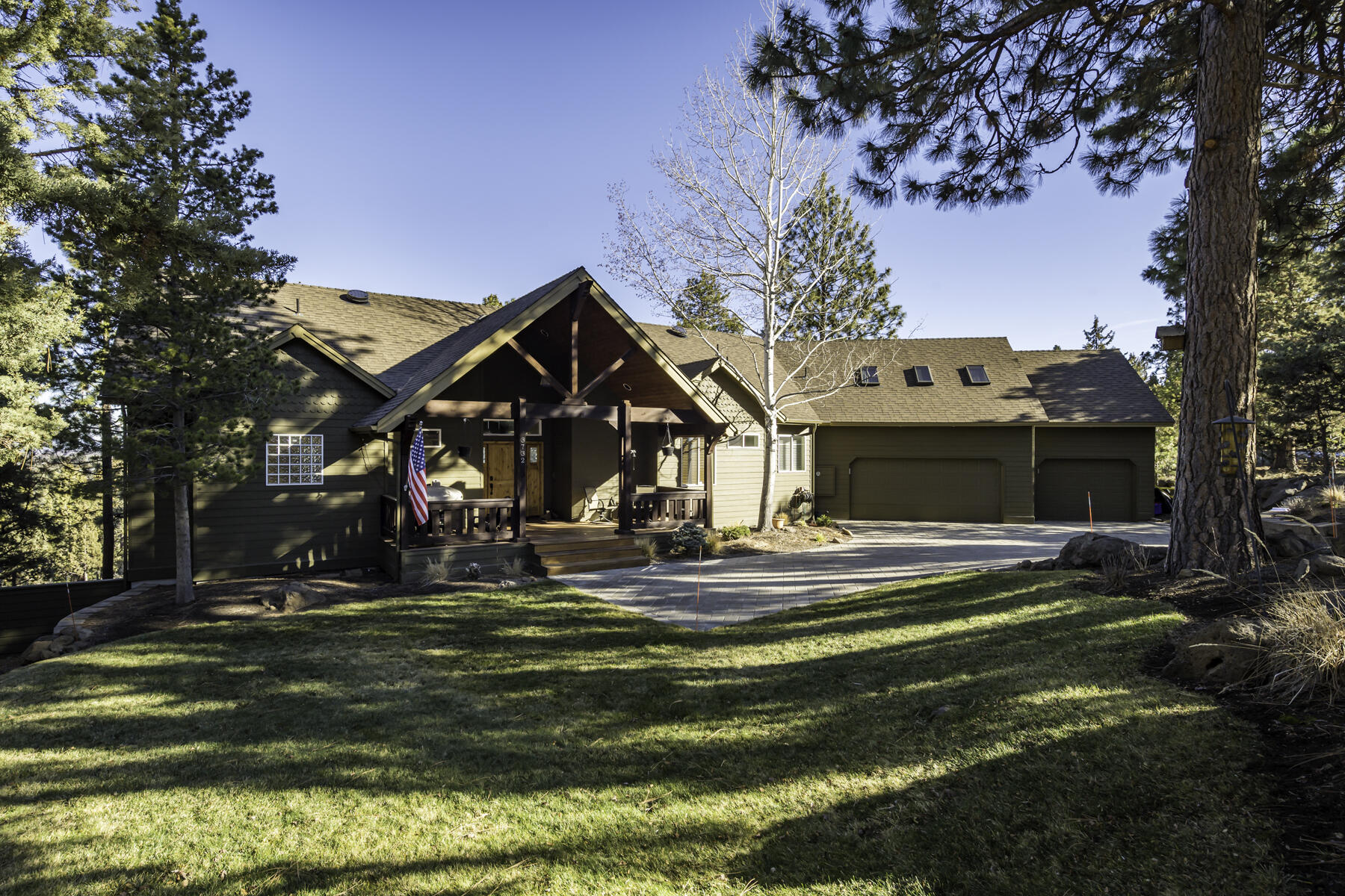 Enjoy privacy and views from this gorgeous home on a large lot in popular NW Bend! The huge windows in the vaulted great room let the light in, the gourmet kitchen features an extra large granite center island and Viking appliances and separate pantry area are perfect for entertaining and cooking your favorite meals. Watch the beautiful Deschutes River flow while you are at the kitchen sink. The 2529 SF home offers single level living with the primary suite, a second bedroom or office, along with a second full bathroom and a large utility room on the main floor. Upstairs is a third bedroom, full bathroom and living space, perfect for guests or bonus space. The extensive decking off the great room provides lots of outdoor living options while enjoying the quiet nature sounds, views of the river and trees. The large covered front porch offers more space for enjoying the outdoors. The three car heated garage has plenty of room to store your toys. All this and more, come see it today!
