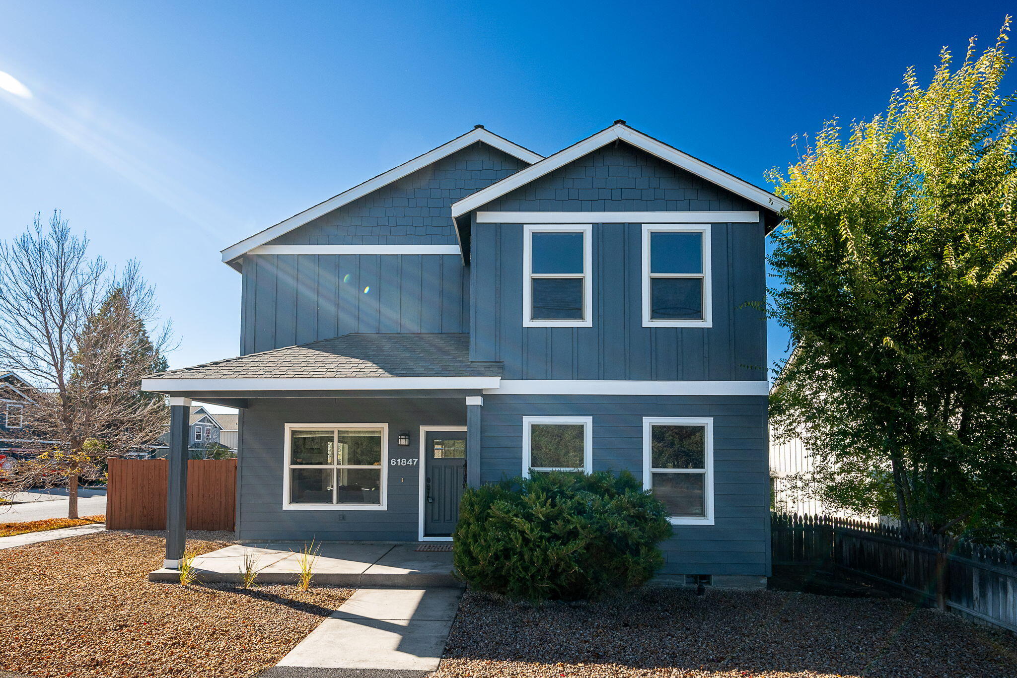 Creative Seller Financing Available! This SE Bend home gives you space to live, work, and entertain. The main level offers a generous primary suite with soaking tub, dual vanity, separate shower, and walk-in closet. The kitchen includes a breakfast bar, black leathered granite, and pantry, plus a powder bath and true two-car garage. Outside: easy-care landscaping with sprinklers, fenced yard, covered dining patio, and an RV-ready private rear drive. Upstairs, a huge flex space with Pilot Butte views is an ideal work from home setup. Three bright bedrooms share a full bath with dual vanities, and an oversized laundry adds convenience. Recent updates include fresh paint, new flooring, trim, hardware, lighting, countertops, undermount sink, and fridge. And with seller financing, you can make this place home sooner than you think!