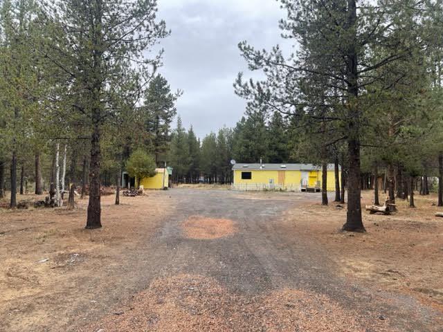Value is in the land. Manu home in very poor condition. Level 1.03 acre treed lot features a private fenced setting, standard septic, private well.