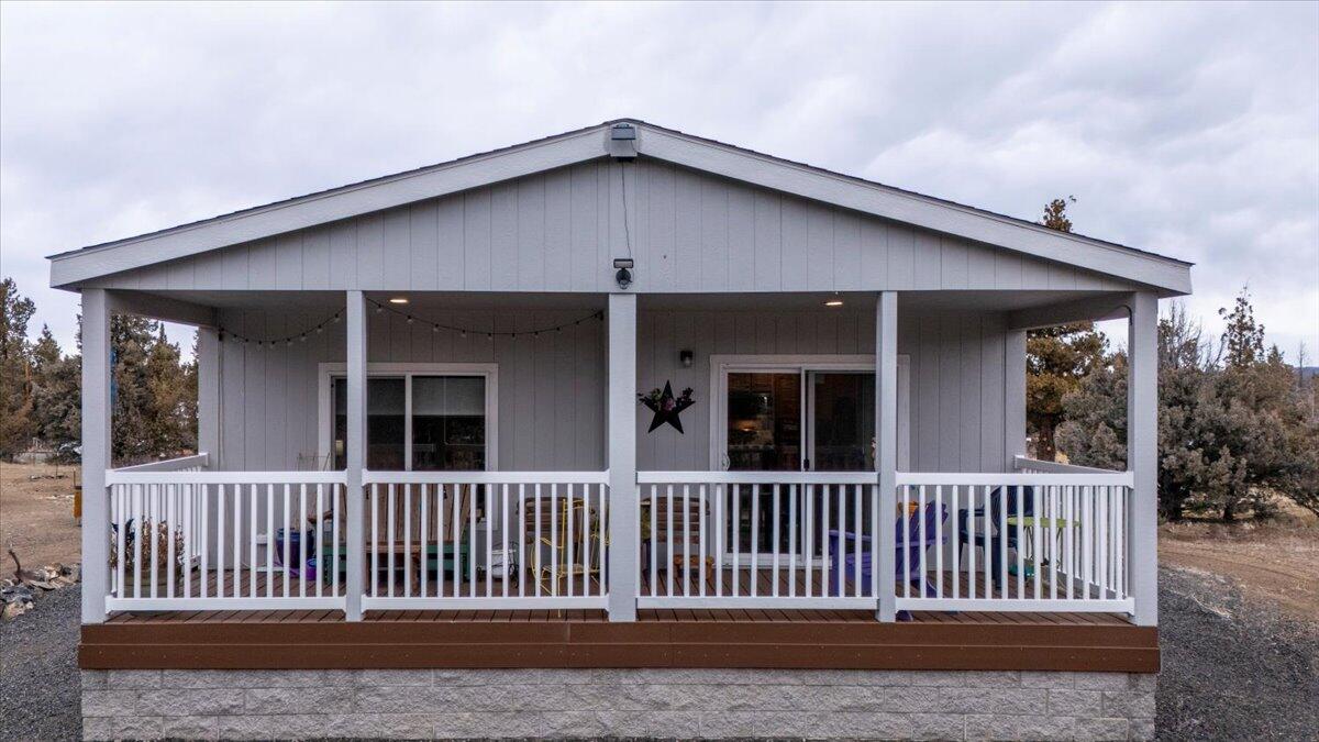 Seller is open to offers that include buyer concessions—ask about options to help with closing costs or an interest rate buy-down!

Are you looking for potential dual living? Inside the shop, you'll find an additional 1,000 sq ft living space with appliances included, ideal for guests, work or flex space. There is an attached carport and has 2 water/electric hookups for RVs. Not to mention 200 amp panel designated just for this building.

The manufactured home is newer and the property is fully fenced. Enjoy the convenience of paved roads to the driveway, two large carports (one with a concrete floor), and a gated entry. The property features a shared well with only one neighbor, a spacious greenhouse and garden beds.

Located in PLA2, the community benefits from a special road district and proximity to the reservoir. This property offers privacy, practicality, and endless possibilities.
*One year Home Warranty included with acceptable offer*
