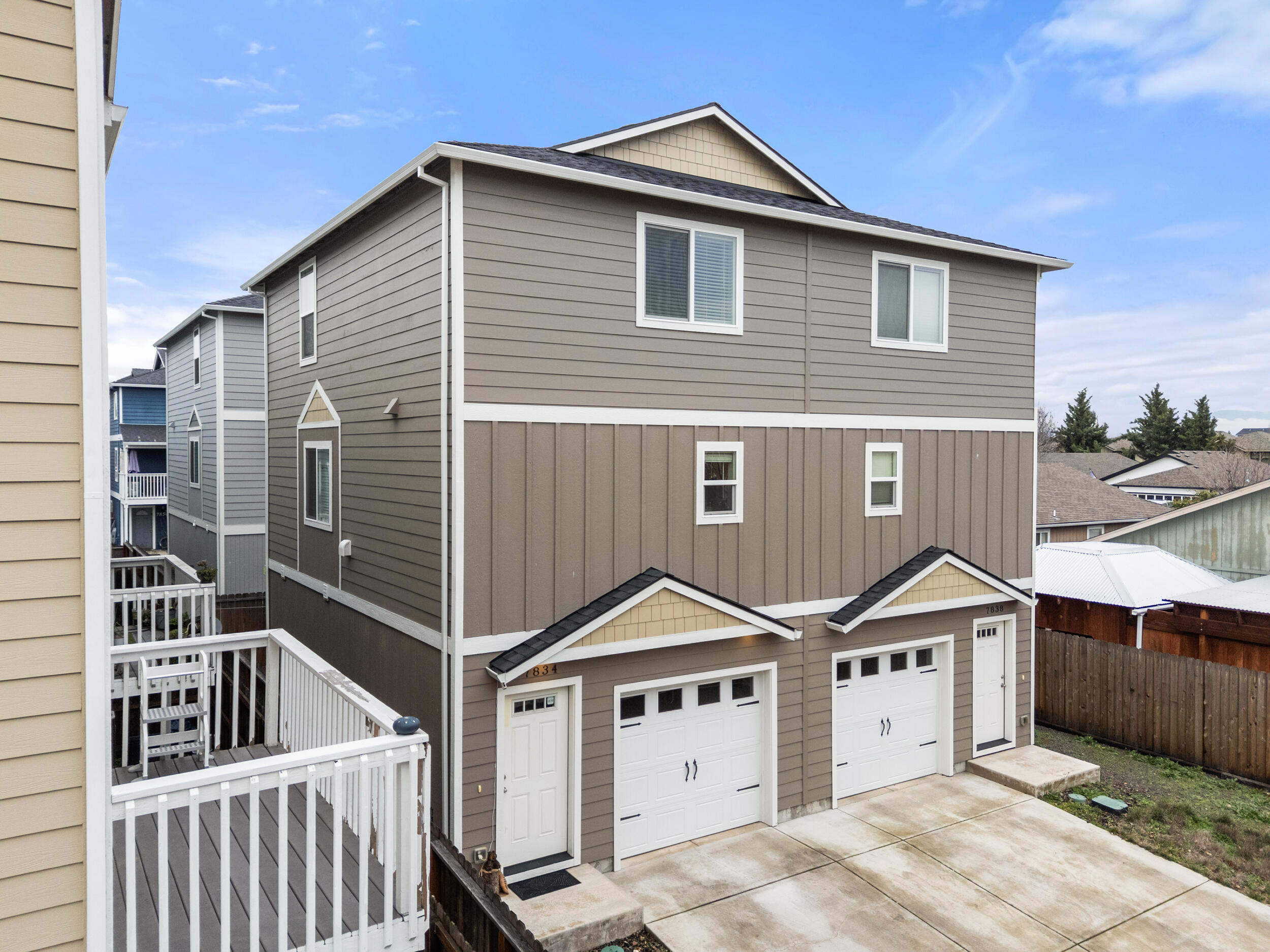 Built in 2022, this contemporary townhouse in Jacqueline Estates Phase 1 offers efficient design and low maintenance living in White City. Featuring 1,303 sf, 2 bedrooms, a bonus room and 3 bathrooms (1 full, 2 half), the layout provides flexibility with bonus room and half bath on the ground level—ideal for a home office, workout space, or guest area. The main living space is located on the second floor with an open-concept great room and kitchen featuring granite counters and stainless appliances (refrigerator, range/oven, microwave, dishwasher included). Bedrooms and full bathrooms are located on the third level for added privacy. Additional highlights include ductless heat pump, ENERGY STAR-qualified equipment and windows, finished attached garage, and fenced, landscaped lot. HOA dues are only $110 annually and include landscaping. Convenient location with easy access to Medford, services, and amenities. One of the most approachable newer-construction opportunities in Rogue Valle