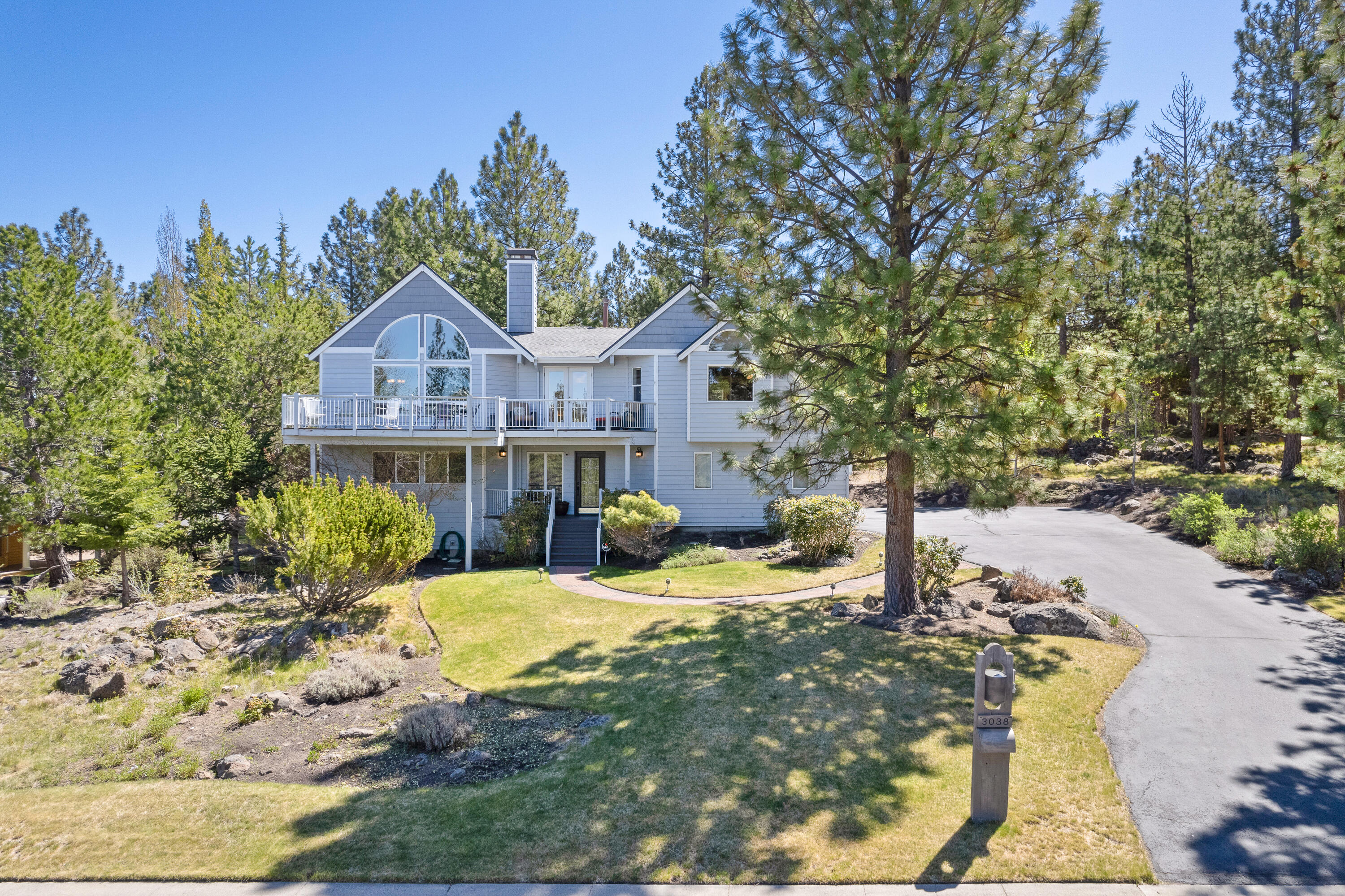 Perched atop Awbrey Butte this immaculate, custom built, one-owner home was thoughtfully designed to take advantage of the  Cascade Mtn views and provide a feeling of privacy & treetop living. The reverse-style floor plan features a sunny, vaulted open  great room w/ pristine Teak hardwoods, updated gourmet kitchen/dining area w/breakfast bar & loads of cabinet storage, picture  windows throughout the main level, gas fireplace, new Hunter Douglas blinds, multi-decks for outdoor living & entertaining, built-in  speakers, large primary suite w/double walk-in closets, bathroom soaking tub, large walk-in tiled shower & additional door access to  back deck. Additionally, the ground floor offers 2 spacious bedrooms plus a generous family room/bonus room with a gas fireplace,  deck to backyard, full bathroom & 3 car garage. The park-like .59 acre lot has a mix of native landscaping & mature trees along with flat landscaped areas-ideal for those seeking privacy and tranquility.