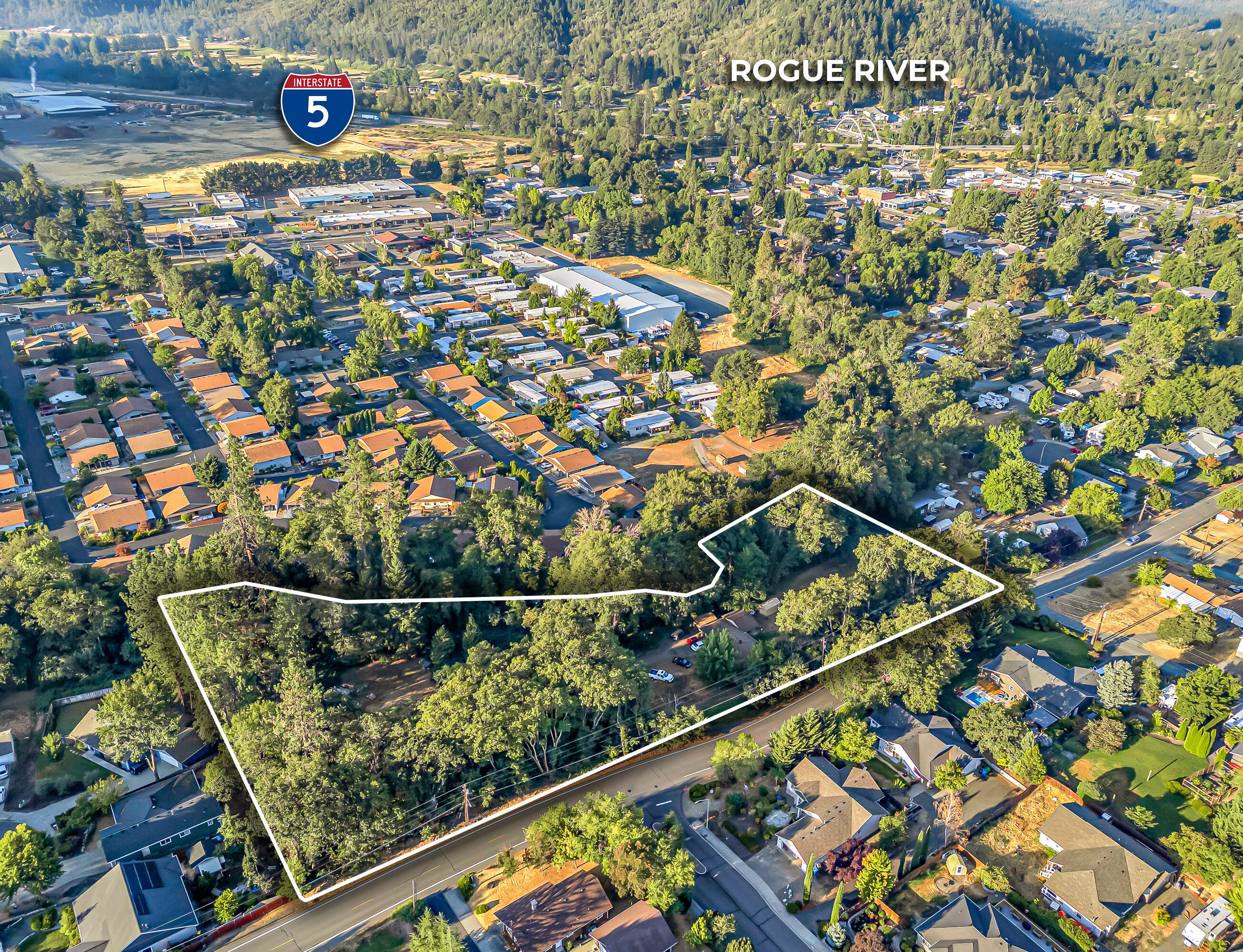 PRIME BUILDER OR INVESTOR OPPORTUNITY! This mostly flat, usable 3.17-acre parcel offers plenty of space with open meadow area and Wards Creek frontage—offering potential for a scenic common space or walking trail. With R-1-8 zoning, there's incredible building potential, and options to subdivide (per city) making the possibilities wide open! Utilities are available at the street, and the City of Rogue River is eager to work with buyers on future improvements. Conveniently located near schools, parks, and shopping, the property provides the perfect balance of peaceful rural charm and easy access to town amenities. All information provided is deemed reliable but not guaranteed; anyone considering purchasing this property should perform their own investigation into the uses and condition of the property. Property is tenant occupied, DO NOT disturb tenants.