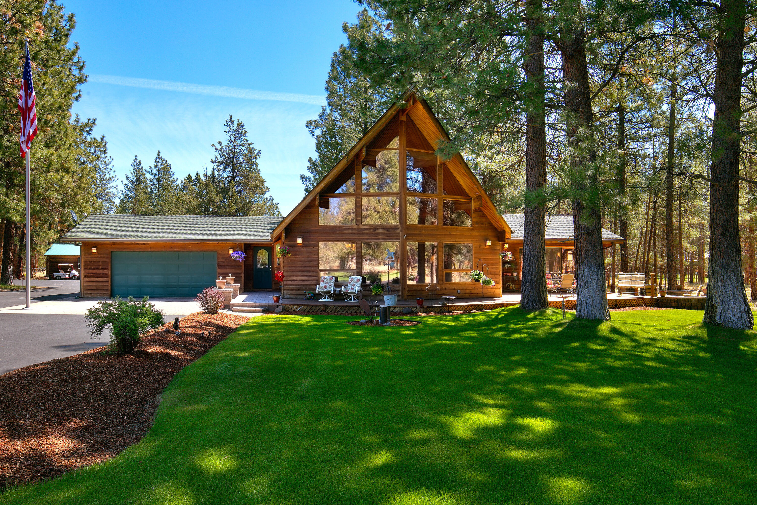Picture yourself here! This Lindal cedar home on 5.58 acres has it all. The beautifully maintained property features expansive lawns and landscaping, old growth pine trees, a 2304 sq. ft dream shop with three bays, garden shed and multiple outdoor living spaces. Inside the home enjoy a great room floor-plan with beautiful woodwork, propane stove to keep you cozy, floor to ceiling windows and vaulted ceilings in the great room. The home features 3 bedrooms and 2 baths all on the main level. A master with a tile shower, another bedroom with an ensuite bath, and a third bedroom with a kitchenette opening to an outdoor deck. The upstairs loft is perfect for an office/media room/4th bedroom. Enjoy outdoor living at it's finest with two decks and patios, outdoor gas fire-pit. The shop is a car lovers dream with car lift, multiple work spaces and is big enough to store a 40 ft motorhome! Property is fully fenced and is only minutes from downtown Sisters.