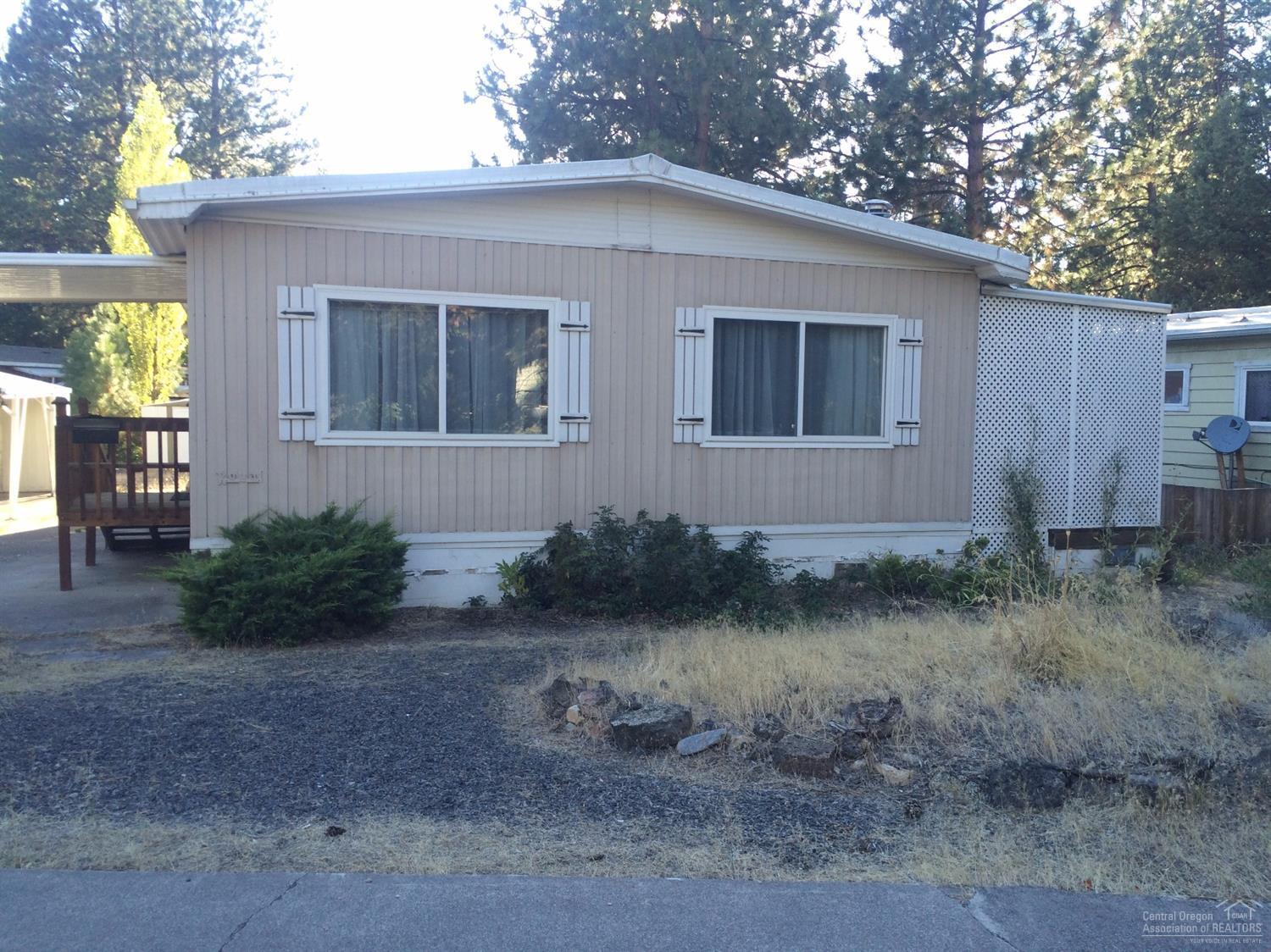 Beautiful remodeled open floor plan w/granite island & countertops. New dishwasher, cabinets, new lighting makes this home bright & fresh. New washer & dryer, 2 storage sheds & covered deck. Phone, stereo & TV cabling throughout. Close to pool & Clubhouse. New electric panel. Sold as-is.