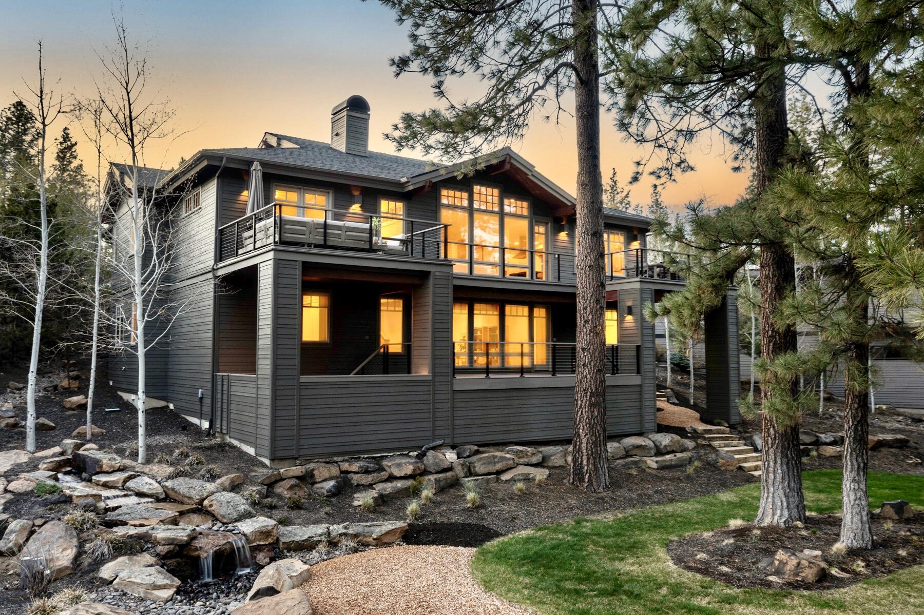 Come experience all that Bend has to offer from this expansive retreat in The Reserve at Broken Top. Nestled in the pine trees on a spacious lot providing peaceful outdoor spaces with waterfall features and trail access out the back door, this custom Pacwest Builders home has a versatile layout for comfortable living and easy entertaining. Quality timeless finishes are coupled with numerous recent updates including refinished hardwood floors, new carpet, fresh paint inside and out, new decks and railings, resurfaced driveway, new furnace, 10.5kW solar array and EV charger. Main level primary, 2nd ensuite bedroom and plenty of room for work, play or relaxation with rec room, 6th bed/bonus and equipped theater room. The ideal location provides effortless access to Phil's Trail complex and the National Forest for endless recreation while maintaining convenient proximity to NWX and Galveston corridor shops and dining and top westside schools. A perfect base camp for your lifestyle!
