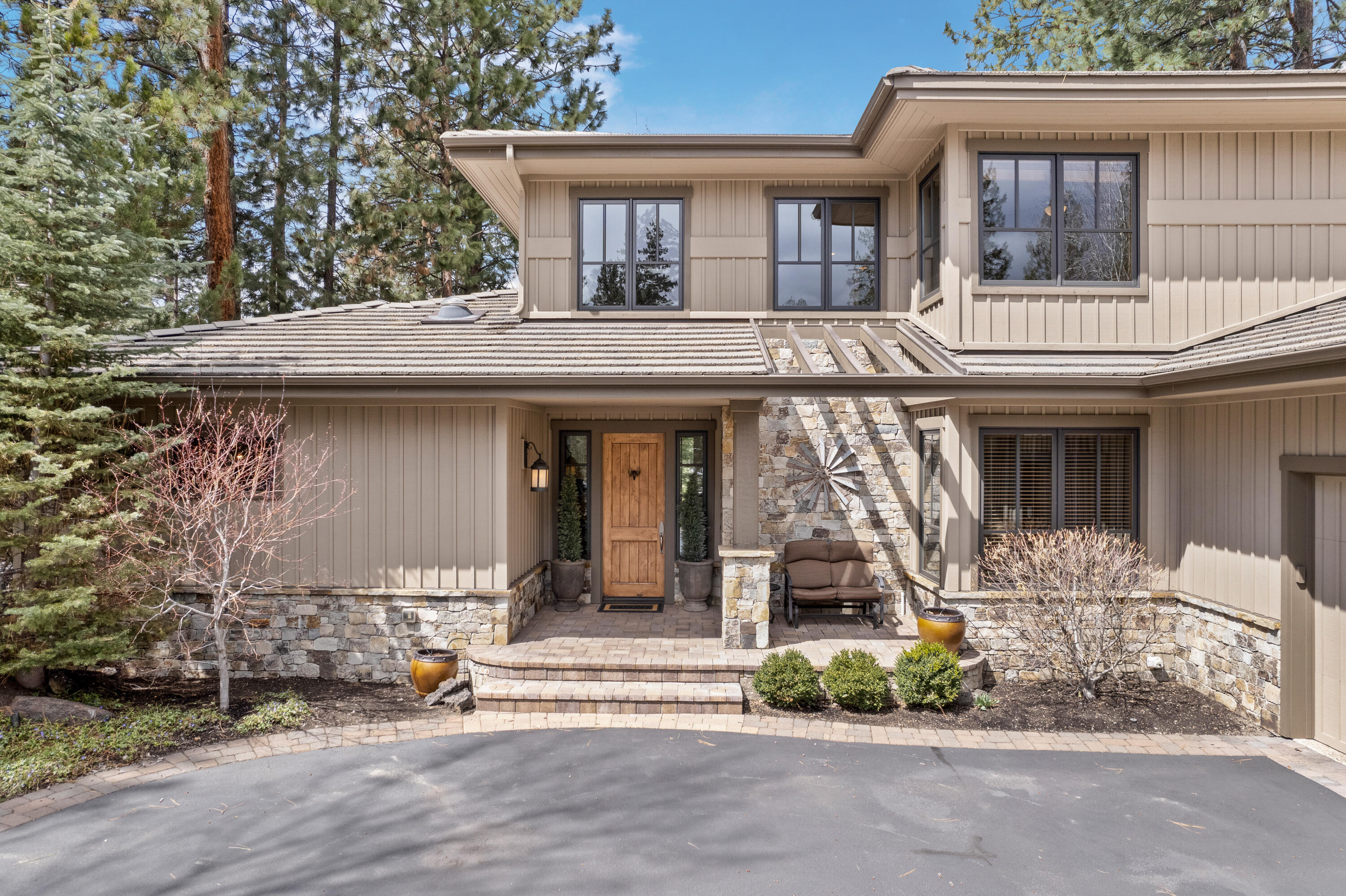 This stunning home is located on the first green of the Broken Top golf course community. Beautifully updated & maintained, w/ views of the course, & wonderful landscaping including a striking water feature in addition to an epoxy coated triple-car garage w/ an attached addition just for your golf cart. The open floor plan features a vaulted great room w/ wood-beamed ceilings, a floor to ceiling rock fireplace, custom cabinets, & hardwood floors. You'll love the chef's kitchen which also includes an ice maker & beverage bar. The updated primary suite is located on the main level & boasts two closets, a free standing soaking tub, step in shower and heated floors. Also on the main floor is an office w/ plenty of storage & can be used as a 5th bedroom. Downstairs is a second primary suite, media/theater room, second laundry & powder bath w/ access to a covered patio/backyard. Two additional guest rooms are located on the second floor along w/ a jack 'n' jill bath.