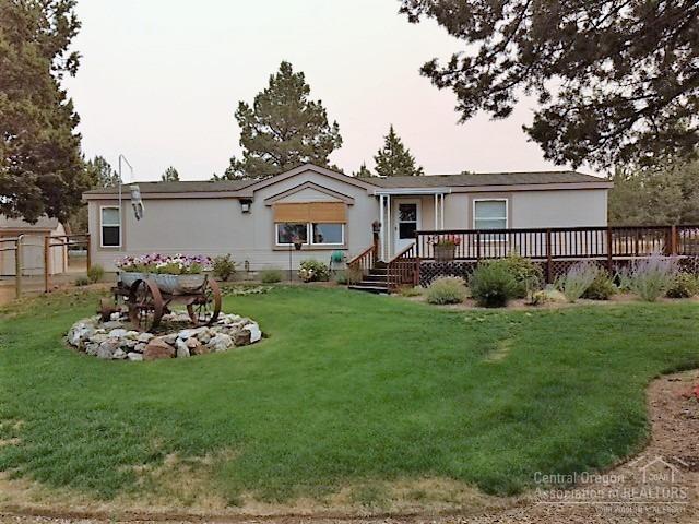 Very well kept beautiful 3 bedroom, 2 bath home on 1.1 acres. Jefferson & 3 Finger Jack Mountain views. Sited next to community property on South side. Back yard fenced. New roof & skylights, newly painted in/out, Walk-in pantry, cozy propane stove in LR, vaulted ceiling w/fan. All appliances including washer/dryer & frig. Over sized rooms w/walk-in closets, 24x32 semi-finished garage w/shop area & gd opener, lots of room for RV's, RV gate and RV septic hookup.