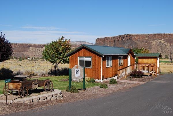 Wonderful opportunity to own a commercial building on .57 acres overlooking the Crooked River Ranch Golf Course. Paved parking lot, office, lobby, bath. Easy care landscaping.