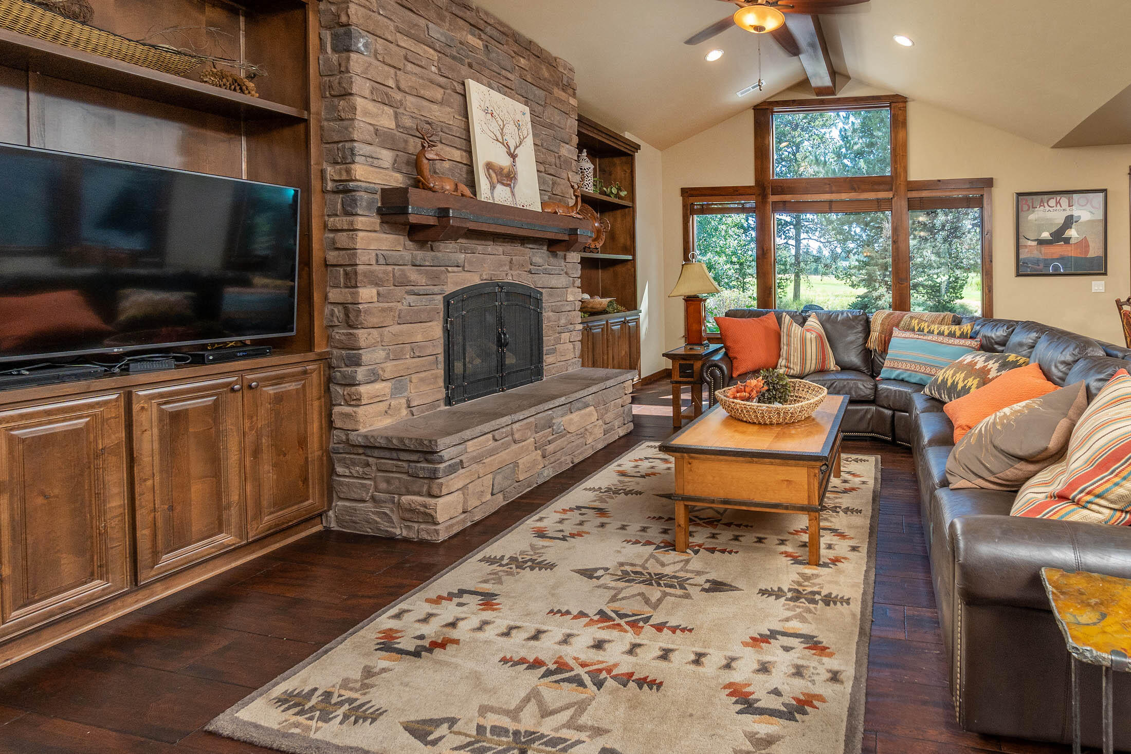Caldera Cabin with views of Caldera Links executive golf course! High end features throughout, including gourmet kitchen with slab granite counters, knotty alder cabinets and gas cook top with copper hood. Vaulted ceilings in the great room, gas fireplace with raised hearth and built ins. 3 master suites downstairs, plus an office/sitting room. Additional suite upstairs includes two built-in bunk beds and a bonus area. Outdoor living space with covered patio, hot tub and views of the golf course. Private driveway leading to a 2 car garage.