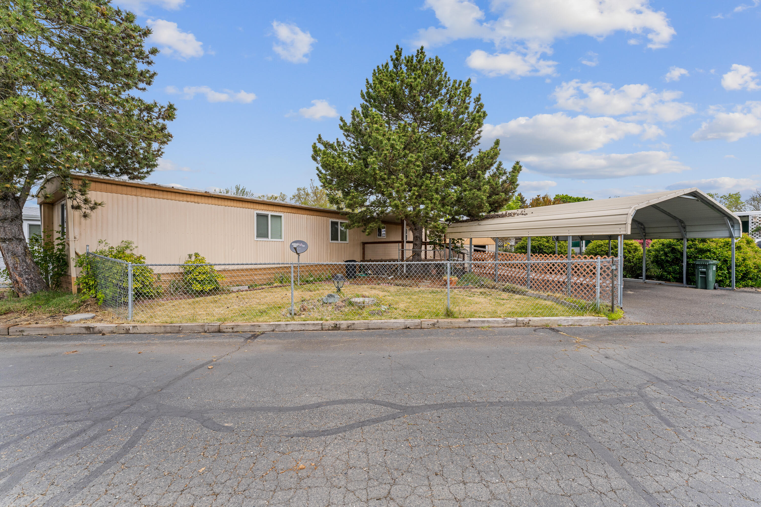 Welcome to your cozy retreat at the +55 Riverhaven Mobile Home Park. This inviting 3-bedroom, 2-bathroom mobile home offers a perfect blend of comfort and convenience in the highly sought-after Redwood Ave. area. Enjoy picturesque views of Redwood park while indulging in activities like pickleball, tennis and a walking path just steps from your door. Well-kept home with updated windows and newer carpeting, this home has charm and warmth. Featuring a membrane roof, fenced yard, wheelchair ramp, and a spacious carport. Unwind on the newer Trex deck, perfect for serene evenings under the stars. Don't miss this opportunity to experience the best of mobile home living in a prime location with low rent space with water, sewer and trash all included! Pets are allowed with approval from the park manager.