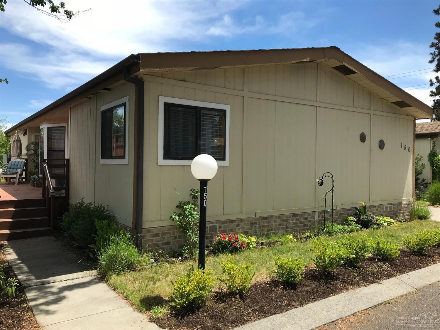 Well cared for home in one of Bend's finest 55+ manufactured home communities. This 3 bedroom, 2 bath home has 1,539 sf of separated living space, as well as carport & storage room. Space rental includes water, sewer, trash, snow removal & access to the clubhouse. Newer heating & split A/C unit. Washer, dryer & refrigerator included. Ready to move in!