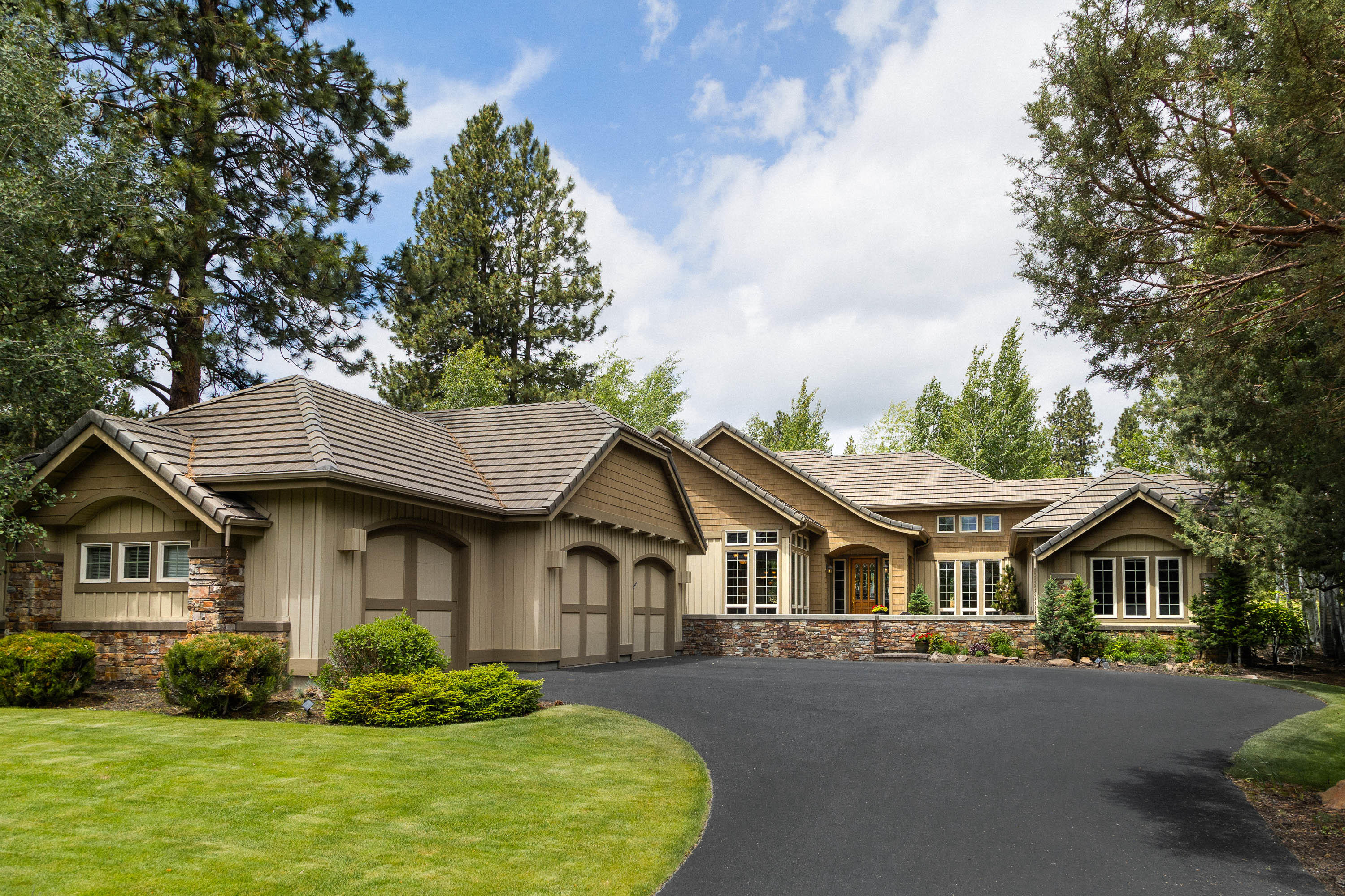 Serenity & casual elegance w/golf course view of the 3rd fairway! This single level cedar sided home has a long life tile roof, inviting entrance courtyard w/water feature, private back yard patio w/stone fire pit! Hickory hardwood floors highlight the great room w/slate surround gas fireplace, a wall of built-in cabinets & vaulted ceilings. Adjacent dining area has matching wood built-in buffet & china cabinet. French doors lead to your home office or library w/more built-ins. Gourmet kitchen featuring Wolfe gas range top, granite counters, center island, breakfast bar, pantry & beautiful cabinetry. Double pane tall windows w/custom coverings deliver plenty of light. The primary bdrm & one of the two guest rooms are en-suites & baths have radiant floor heat. The 3-car garage, has built in cabinets-workshop area, floored attic for storage & 2020 hw recirculating pump. An in-ground electric fence is in place for your pets. Showings begin Wednesday 6/16! Open House Sat. 6/19, 12-3.