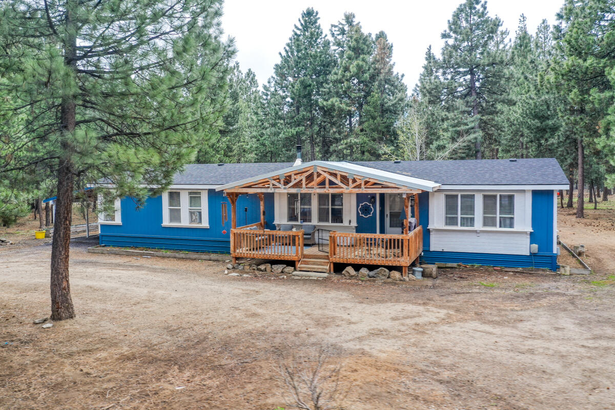 Nestled in the woods on a partially fenced 10.7-acre lot (3.5 acres are fenced), this highly sought-after La Pine property offers the ultimate horse setup and serene lifestyle. Experience tranquility on this remarkable land—perfect for forest bathing, trail riding, and reconnecting with nature. Just minutes from fishing, skiing, hiking, and town amenities, this peaceful retreat offers the best of both worlds. The updated 3 bed, 2 bath, 1,782 SF home features skylights, new kitchen appliances including a gas oven, updated flooring, and covered front and back porches. Several versatile outbuildings include an equipment shed, horse shelter, enclosed storage shed, greenhouse, woodshed, and a finished 500 SF ''we shed.'' Ride your horse or take your ATV all the way to Wickiup Reservoir without touching pavement. With 2 tax lots, natural privacy, and wide open space, this property is ready for your next chapter.
