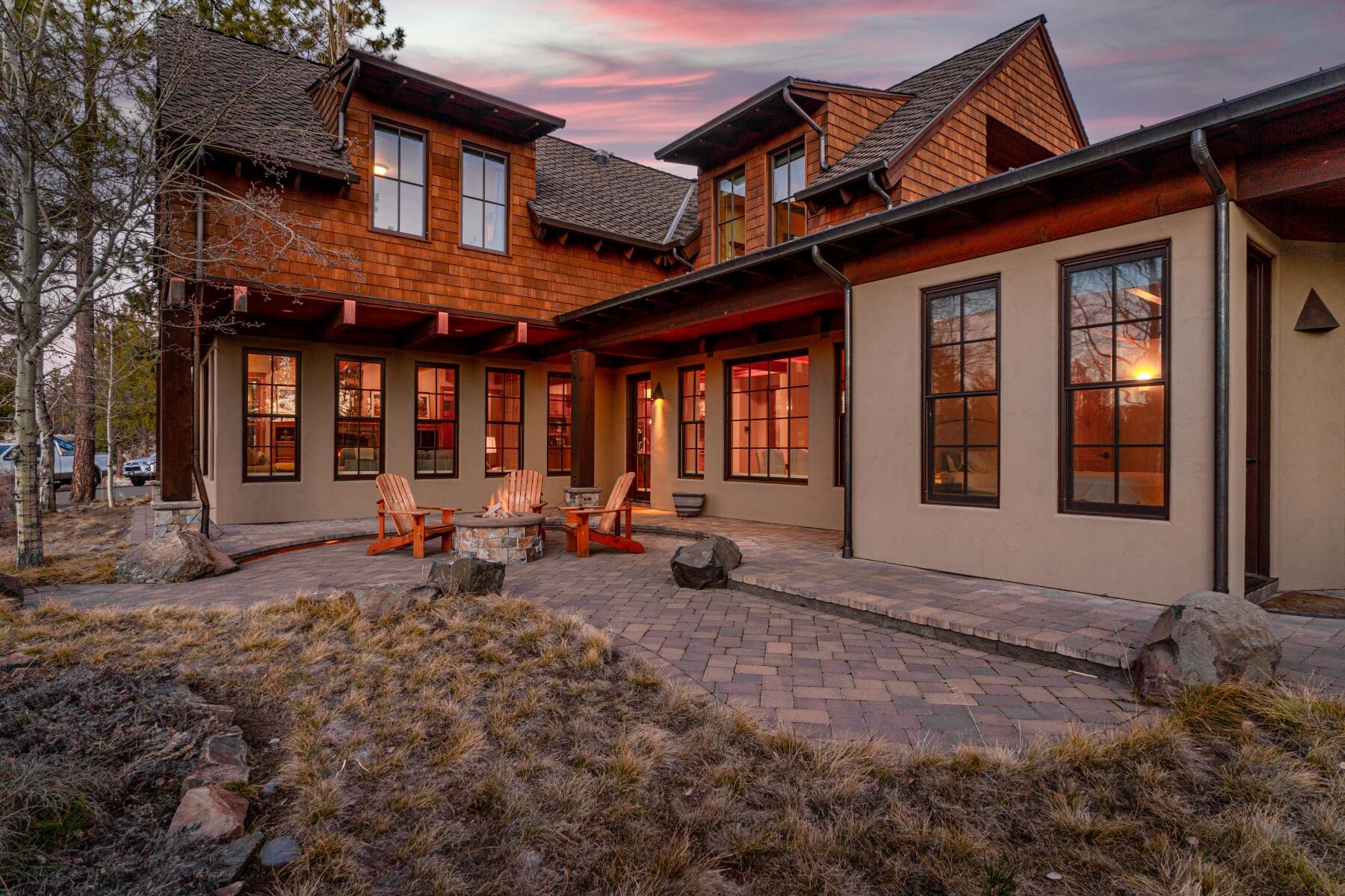 A stunning, impeccably-built custom craftsman home designed by Tozer Design tucked in the secluded Shevlin Commons neighborhood on the edge of Shevlin Park and the Deschutes National Forest beyond. Here, beautiful outdoor living spaces open up to idyllic views of the Cascades, and miles of running and biking trails are easily accessed from the home's front door. Artfully designed, beautifully appointed, and meticulously maintained, this four bedroom features a main floor master with custom wood beams, a high-end entertaining kitchen with butler pantry, abundant storage, and three-car tandem garage with hydraulic lift.