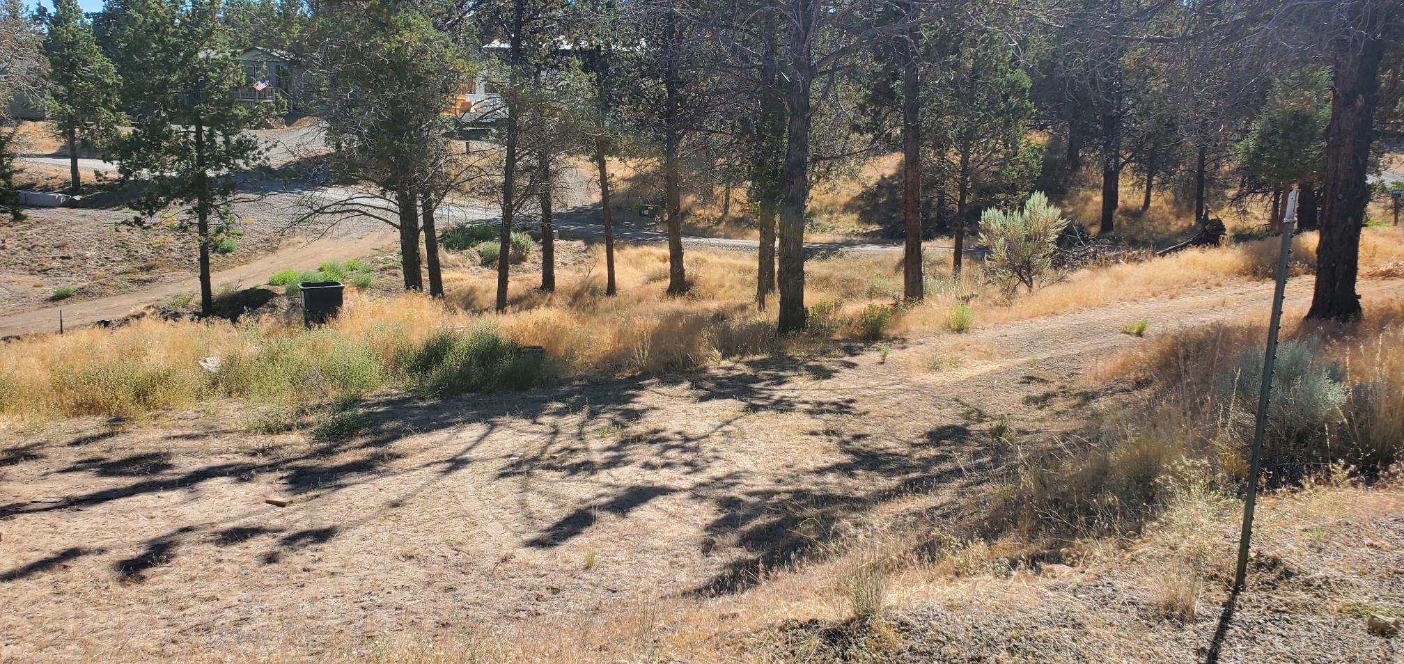 Great buildable lot in Ochoco West with building spot already leveled, power at lot line and water at street. Septic feasibility has been done for ATT system. Survey has been completed and pins are in. Nicely treed with  trees trimmed. Take advantage of all the amenities that Ochoco West has to offer, such as: shooting range, pool, reservoir, stables, and lots of BLM land for hiking, ATV and horse riding.