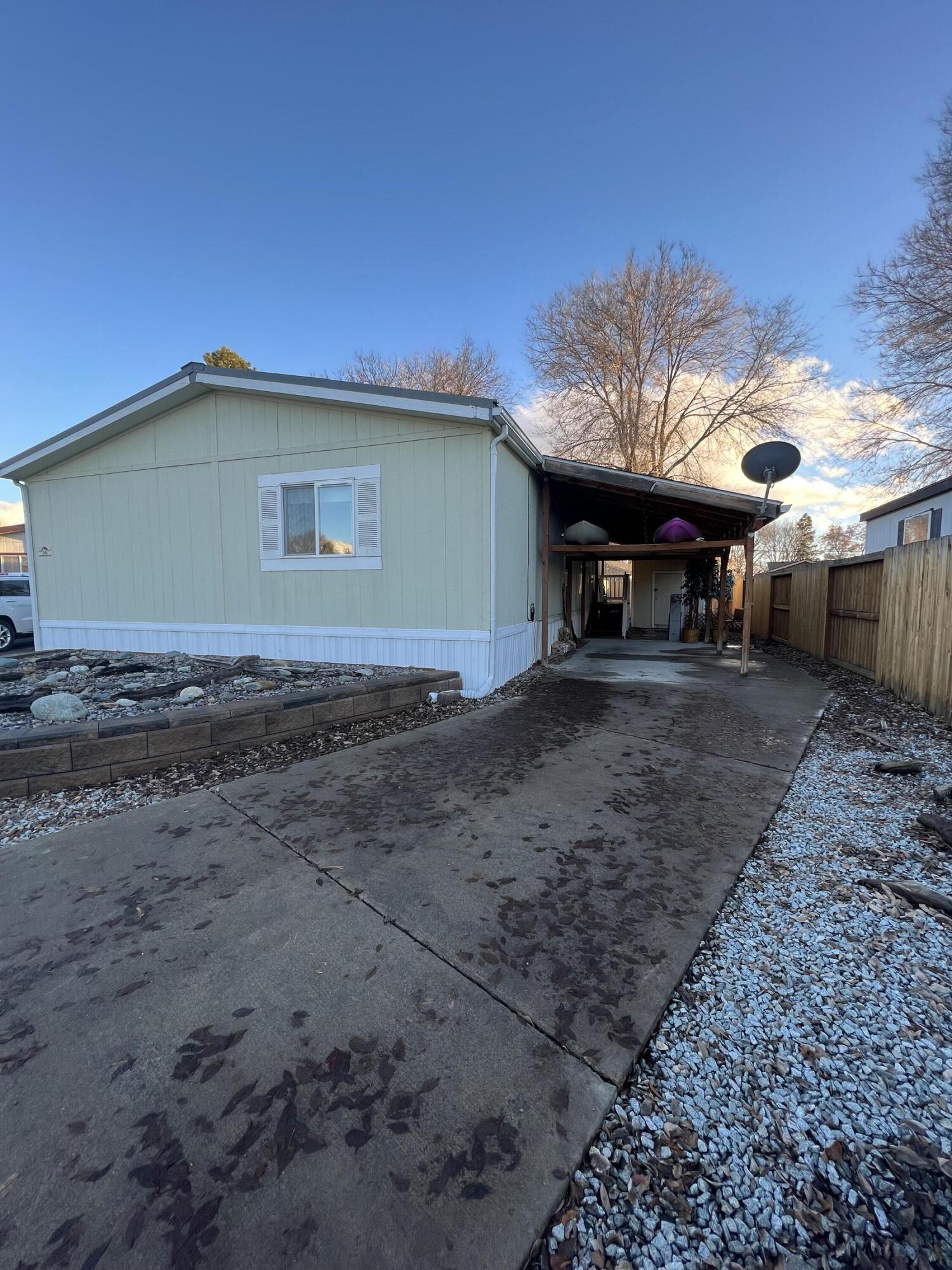 Lovely three-bedroom double wide MFH in Shasta Glen! The floor plan features a spacious, vaulted living room. The kitchen includes all appliances, as well as ample prep and storage space. Adjacent dining room, plus eating bar. Primary bedroom suite features a soaking tub with tile surround and access to a private deck with a hot tub. Indoor laundry room with washer and dryer. Extra deep carport. Shed for extra storage.