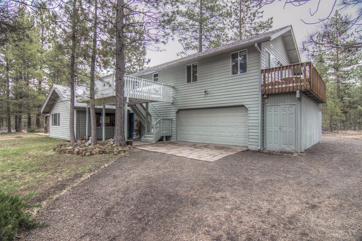 Ultimate Ski Cabin, closest to Mt. Bachelor! Originally designed as a vacation getaway. This cozy 4 bedroom, 3 bath home plus loft, has vaulted ceilings, wood beams, pine paneled walls, pecan cabinets that give it a rustic feel. The home has two balconies and sits high on the private elevated lot. It is barely visible from the street. Heated two car garage. Outside rock BBQ. Seasonal pond. Close to Sunriver. No Home Owners Association fees.