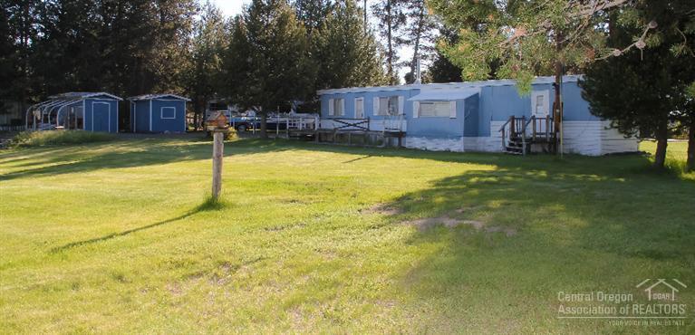 2.51 Riverfront Property. This is a Great Property with Storage Buildings and 2 RV Hookups. Newer Septic installed in 2010. Manufactured home was built in 1972, either put a little TLC into it or remove and build your dream home and enjoy the great views of the river and mountains from your back door. Must See!