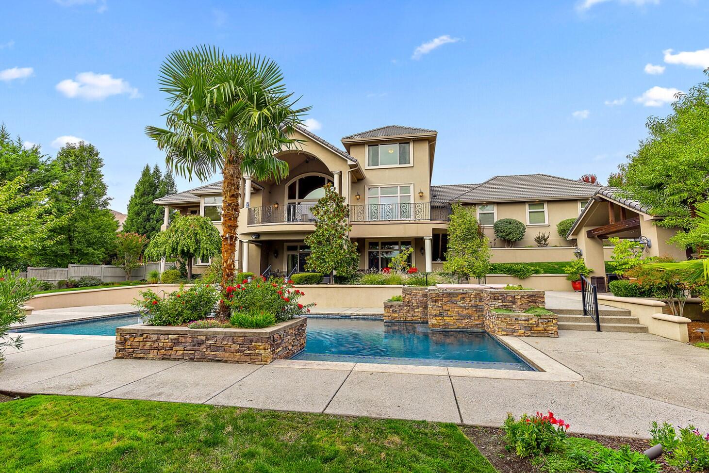 Banks laughed at a 4% rate with Interest-Only payments! WE DIDN'T! Call for details! Upscale resort-style home in Medford's most prestigious area, Saddle Ridge. High-style interior with stunning architectural lines. This is a life experience! Soaring ceilings, walls of glass featuring south valley views, expansive rooms rich in detail & design, multiple main living areas, 4 fireplaces, multiple offices, library, gorgeous wet bar & gym. Stellar chef's kitchen with 6 seat oversized island, double convection ovens, wine refrigerator & breakfast room. Elegant formal dining room with arched entry. Main level luxurious primary suite with fireplace, sitting areas, spa-style bath, chocolate-toned granite, soaking tub & spa shower with multi heads. Numerous outdoor covered view balconies. Inground pool with palms, spa & waterfalls, outdoor covered dining & large outdoor kitchen. Basketball court, RV parking, 3 car garage + tandem spaces. Call for full amenity list.