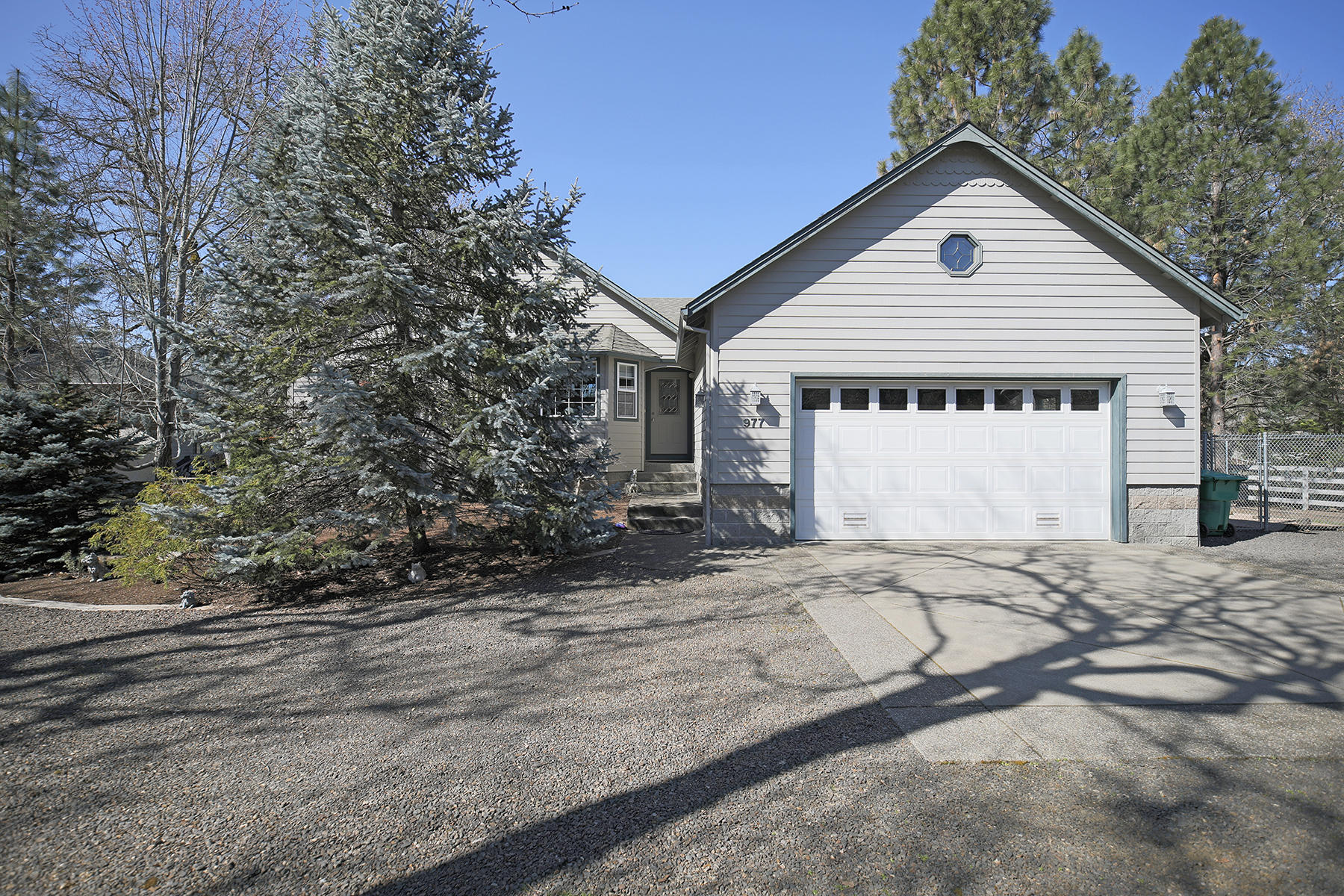 Enjoy spectacular views of the Rogue River from your private patio and dock in this quiet little neighborhood of Shady Cove. Impeccable custom-built home is single story w/ over sized garage and walk-in under-structure. Kitchen has double ovens, a warming drawer, wine refrigerator, instant hot water, water filtration and pantry. Enjoy your morning coffee in the breakfast nook as you look out onto the water. The kitchen and breakfast nook are open to the living room with vaulted ceiling and recessed speakers and a beautiful river rock propane gas see-through fireplace. The formal dining room opens through glass double doors. The master bedroom has sliding doors to covered patio and spa, large walk-in closet and the see-through fireplace. The master bath has a walk-in shower and double sinks. One bedroom with no closet is being used as an office next to master. Second bedroom and bath are on the opposite end of the house. Beautiful covered deck with path to the river.