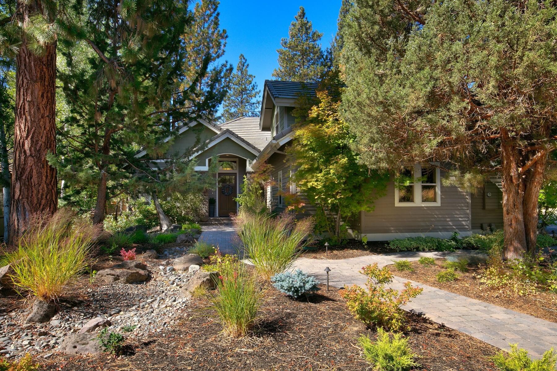 Peaceful & private custom home, mostly single level living, in The Woods at Broken Top. Wonderful corner lot backing to a 10-acre natural park at Tetherow. Built by the high quality builder Pacwest, the home boasts cedar siding, tile roof, an open great room with a gas fireplace, vaulted ceilings & tall wood wrapped windows. Good separation between the main level primary suite, office/bedroom 4, & 2nd bedroom suite. The 3rd bedroom suite plus additional storage is upstairs. Quality features include wood flooring, newer slab granite & backsplash tile in the kitchen, high end appliances, & a spacious laundry. Carefree landscaping, with a delightful front flagstone patio. The rear paved patio with water feature looks out over the forested parkland. Level lot & driveway are bonus features! Recently remodeled primary bathroom, new interior paint, carpet, HVAC & H2O heater. Fantastic neighborhood & location, close to schools, golf, Downtown, mountain biking trails & the road to Mt Bachelor.