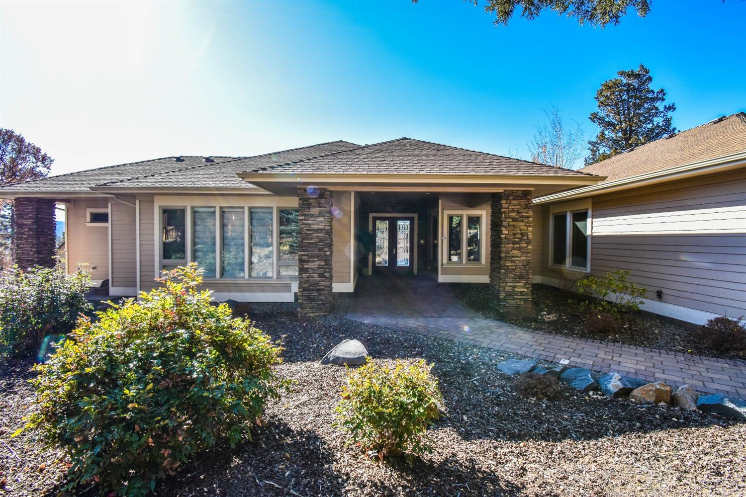 Property sits on almost 3/4 acre w/amazing views of surrounding hills & nearby golf course, w/low maintenance landscaping. Home is single level custom built w/high ceilings throughout, top of the line kitchen & appliances, Master suite on main w/all the amenities, 3 car garage has 14ft high RV 36ft space w/in ground sewer/grey-water hookup, 220 inside & out, padded parking for toys, A/C & gas.
