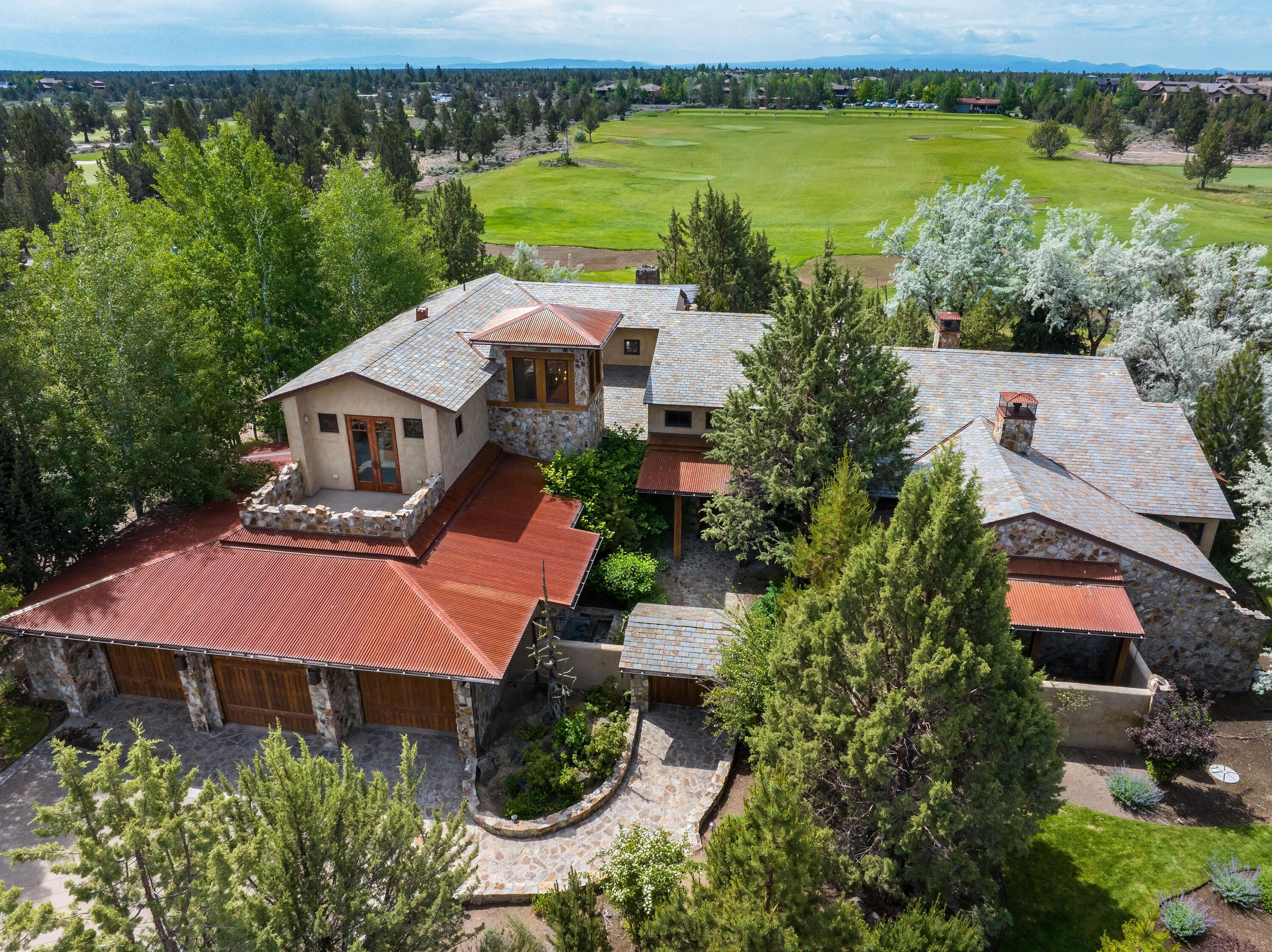 This Dream Estate in the prestigious Juniper Preserve Resort is nestled within the exclusive Pronghorn Community. Situated on .48-acres, it offers a blend of luxury, comfort, & elegance, ensuring a living experience like no other. With 5,118 SF of living space, it includes a 615 SF Casita, perfect for guests or a private retreat. The residence boasts 4 luxurious bedroom suites, including the primary on the main level w/ outdoor spa. Two upper-level suites open to patios & views. Enjoy the professional chef's kitchen w/ prep pantry & wine cellar. The interiors are adorned w/ natural stone & wood accents throughout, adding a touch of timeless elegance & sophistication. The south-facing covered outdoor patio w/ a wood burning fireplace allows for year round enjoyment! Car enthusiasts will appreciate the expansive 1,328 SF garage, which includes space for 3 cars & a golf cart garage. Come enjoy all the amenities in this gated community & play on 2 championship golf courses at Pronghorn!
