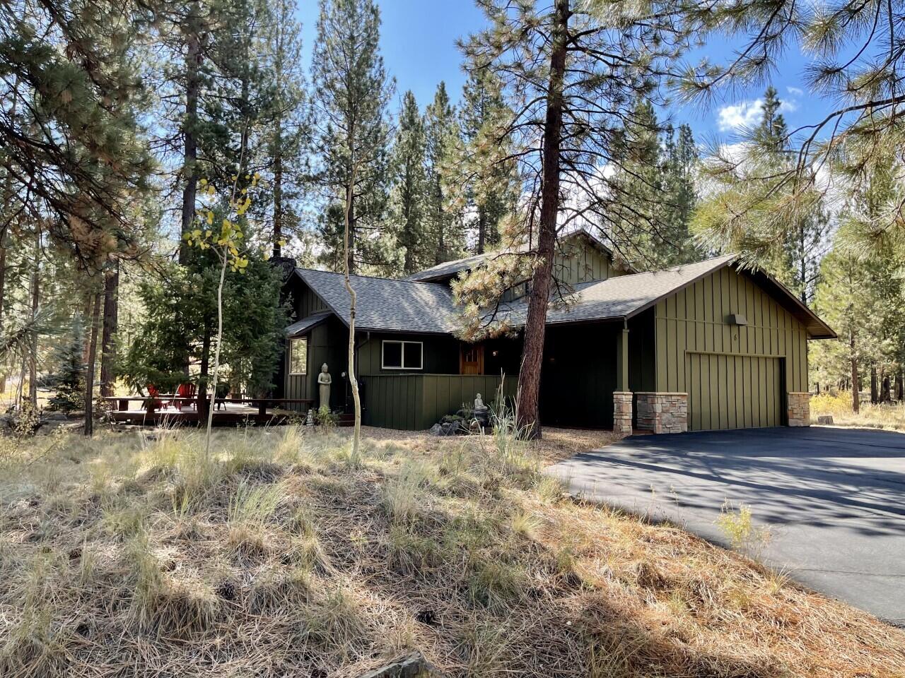 Charming, well-cared for Sunriver home. This unique gem at 6 Forest Lane has 4 bedrooms, 2 bathrooms and over 1700 square feet of gorgeous living space. Cedar wood vaulted ceilings with excellent rock fireplace insert, a wall of windows looking out upon mature ponderosa pine trees over large deck. The kitchen has been tastefully remodeled with tile counter tops, a new refrigerator and smaller drink refrigerator. There are 2 large bedrooms downstairs with a remodeled bathroom, new toilet and tile flooring, tile counter tops, and walk-in shower; 2 bedrooms upstairs, one with a balcony overlooking mature pines and attractive hardscape. The master has cedar vaulted ceilings, with an upgraded bathroom, new toilet, tile counter tops, tile floors, tub shower combination and large walk-in closet. The over-size garage has T&G cedar vaulted ceilings!  Extra storage is a big plus! Hot tub, snow blower and wood supply included. This is a very charming home.