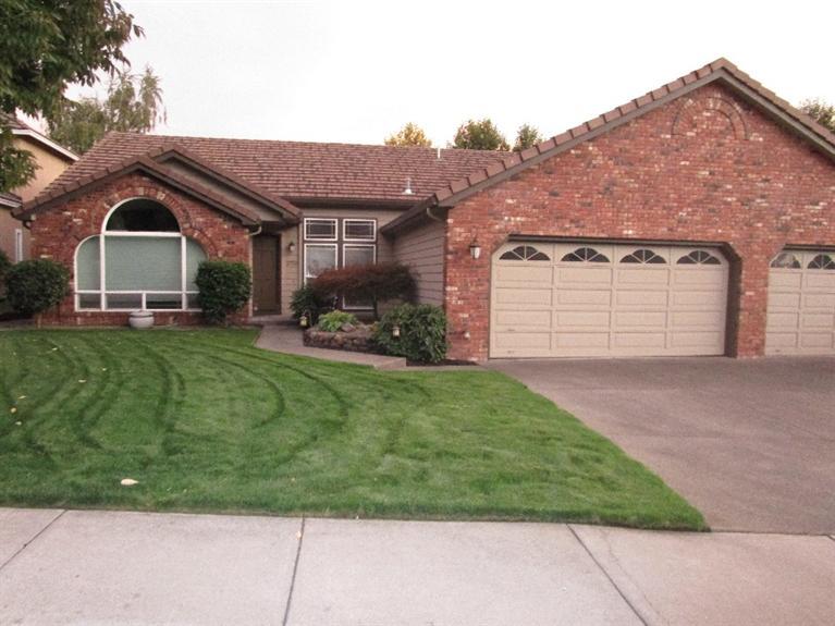 In Amblegreen & affordable! Custom features like 3 sided gas see through fireplace, triple car garage, exterior includes brick arched window! Beautiful interiors, brick front, tile roof and very open floor plan! Vinyl fencing, easy care landscaping, loaded with storage areas. Master suite with slider to back deck, ceiling and shelf detail. In an area of expensive homes!