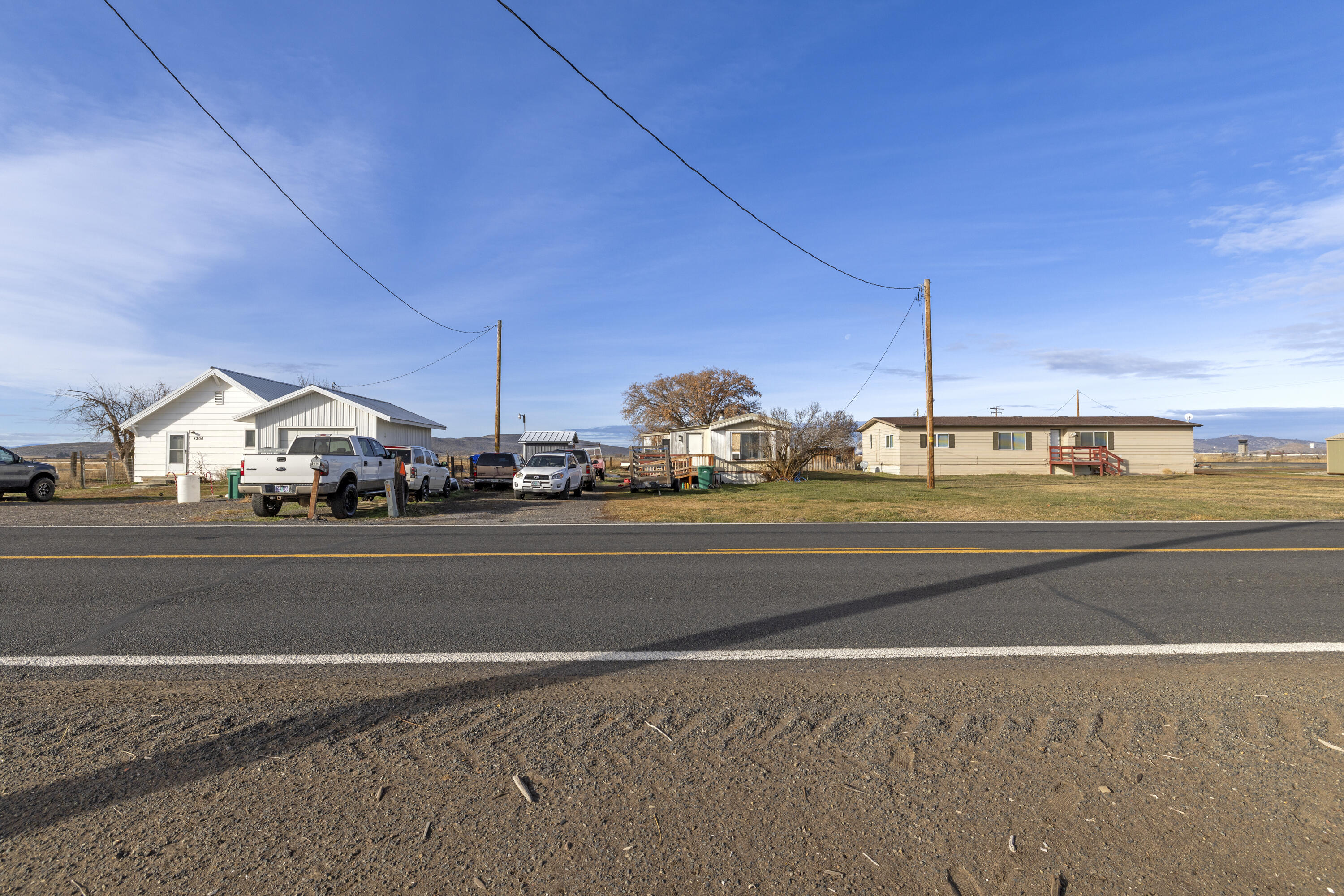 Investment opportunity in Klamath Falls OR!  Income producing 40 + acres of Organic Farmland & 2 Rental homes near Henley Schools. Residential Rental information: 2 BR, 1 Bath house is 912 sf & currently rented for $1250 per/mo. It has a mini split heat/AC, detached 1 car garage and fully fenced.  3 BR, 2 Bath 1980 MFH is 1512 sf & vacant now, last rented for $1650 p/mo.  It features a split floor plan, back porch, electric F/A heat, some updated flooring, walk in shower & closet and a carport.  Additionally, seller is collecting space rent of $300 p/mo for a MFH not owned by the seller. Farmland Rental Information: 32 farmable acres, Certified Organic, KID irrigation, 4 Wheel lines, 2 pumps, each 15hp.  Leased out for the 2026 growing season, crops not included.  Zoned EFU-C.  Separate meters. Large, green shed not part of sale, can be purchased outside of escrow.  Photos of the 2 BR, 1 Bath were taken prior to move-in.  Ask your agent for more details and an appt!