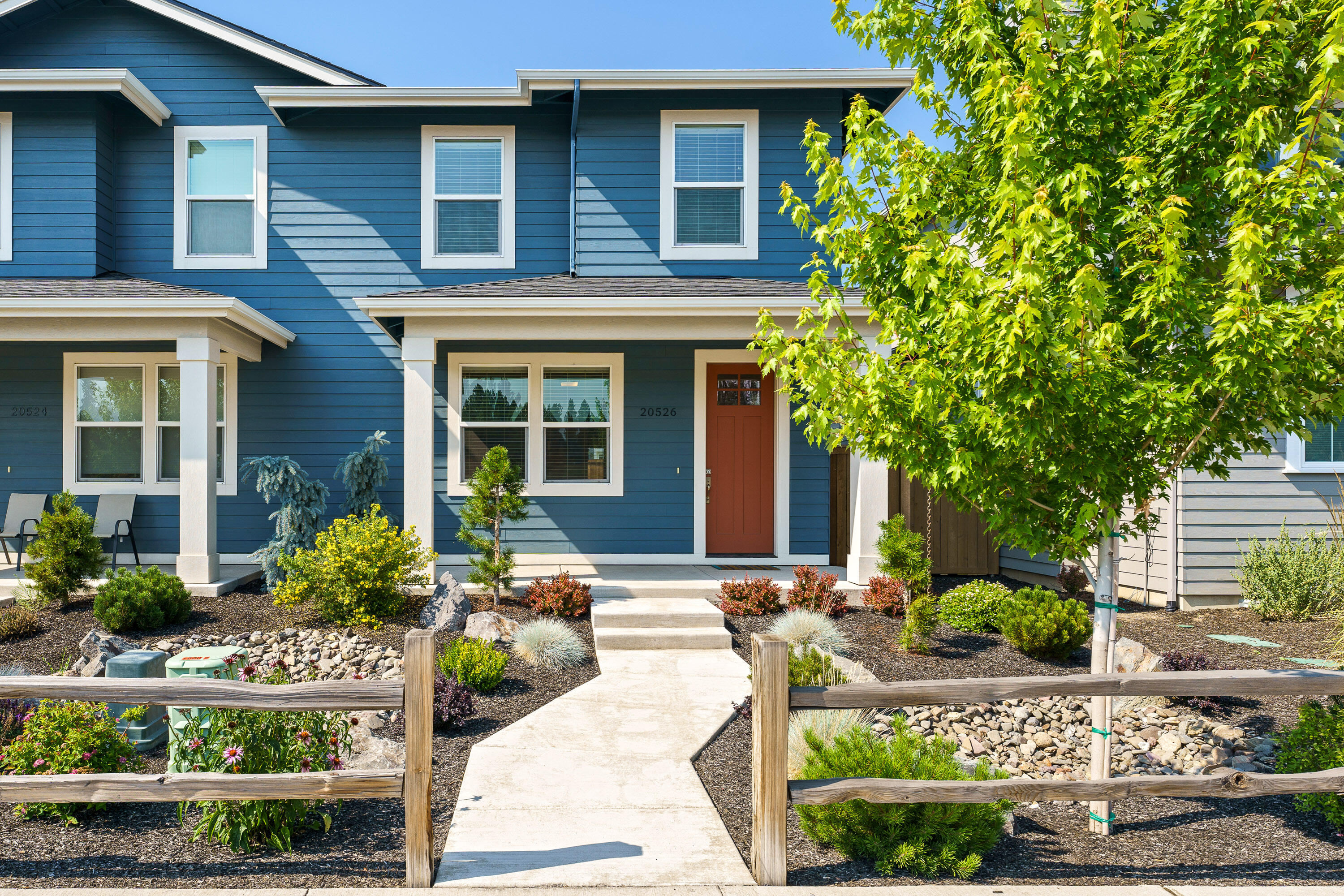 Welcome to this beautifully maintained townhouse in the desirable Countryside neighborhood of SE Bend. Offering 1,704 sqft of comfortable living space, this home features 3 bedrooms, 2.5 baths, and an open-concept main level with high ceilings that enhance the natural light. The kitchen boasts a large island with quartz countertops, stainless steel appliances, and plenty of storage. Upstairs, you'll find all three bedrooms, including a spacious primary suite with dual vanities. Enjoy the fully fenced backyard with a covered rear patio-perfect for relaxing or entertaining. Complete with an alley-load single-car garage, this home blends low-maintenance living with a stylish design in a convenient location.