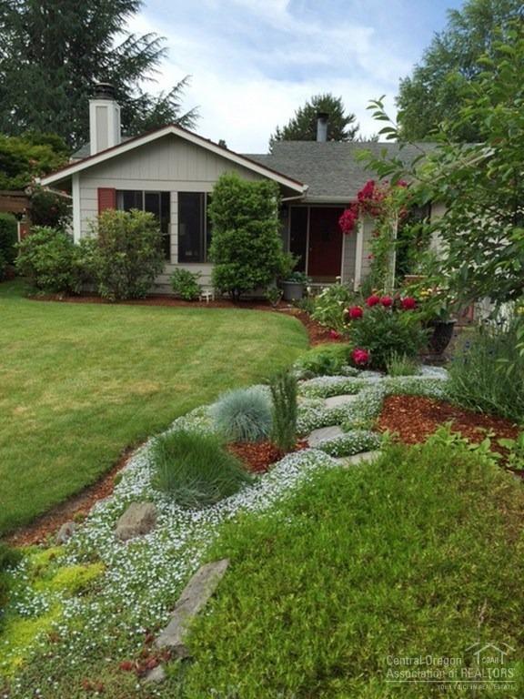 This charming home with its own picket fence is move-in ready and just waiting for your to make your own memories! You'll find this home lives large with a family room, living room, dining room and kitchen nook. New laminate floors, trim, interior and exterior paint. The backyard is fenced and always in bloom. The covered patio makes a cozy space for extending your living outdoors.