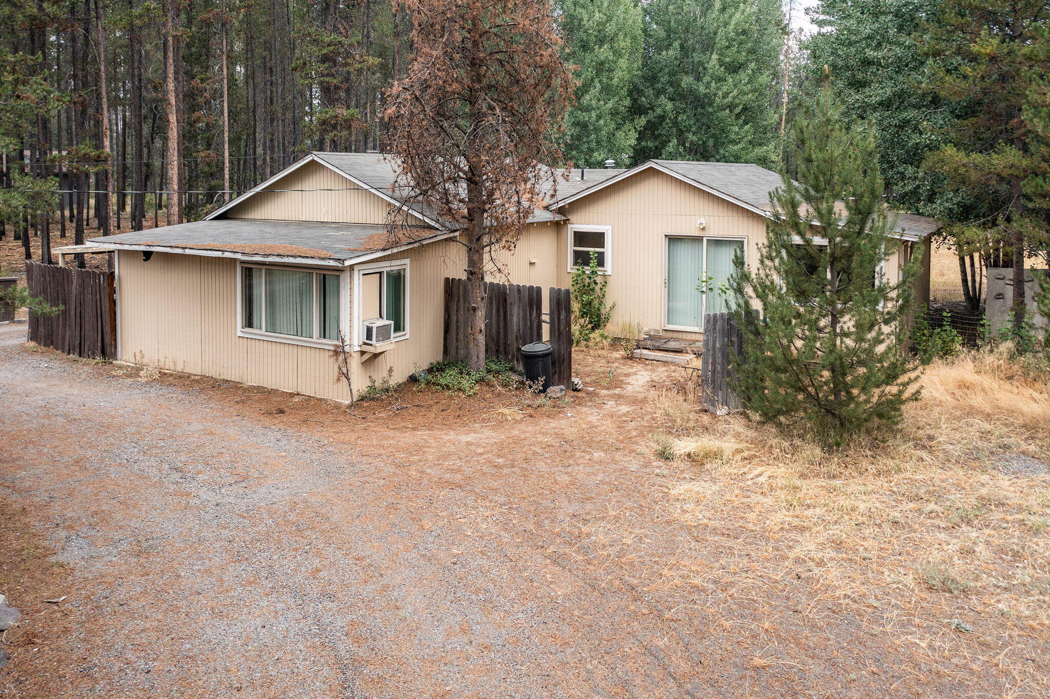 Welcome to your perfect slice of tranquility on Lava Drive in La Pine, OR! This charming 3-bedroom, 1-bathroom home offers just over 1,300 square feet of cozy living space, set on just over an acre of flat, usable land. The property features a fully fenced and gated backyard, providing privacy and security for your peace of mind. Step inside to discover a warm and inviting interior with recent updates - ready for your personal touch. Outside, you'll find ample space for gardening, outdoor activities, or simply enjoying the serenity of your surroundings. The large, flat yard is perfect for building your dream workshop, adding a garden, or creating your own outdoor oasis. Located in a peaceful neighborhood just minutes from downtown La Pine, Quail Run Golf Course, and La Pine State Park; this home offers the perfect blend of rural charm and modern convenience. Don't miss out on this unique opportunity!