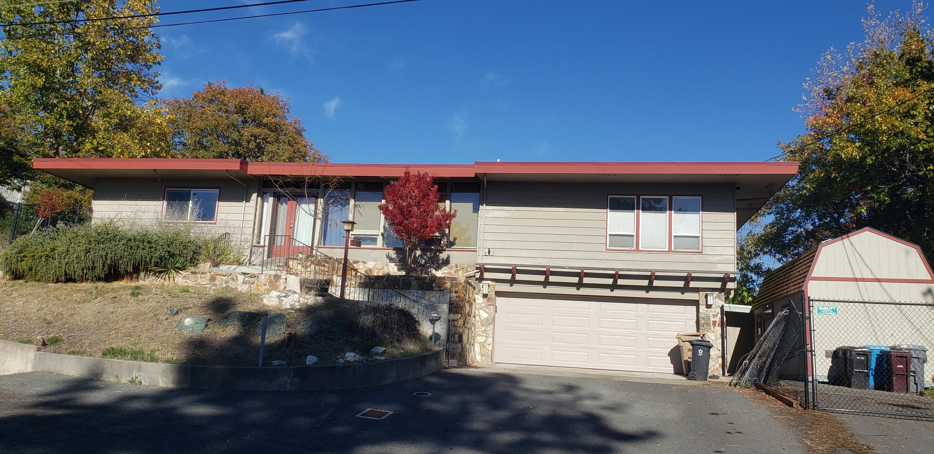 This rare 2,750 sq. ft. Frank Lloyd Wright-style home, built in 1964, sits atop a hill on a quiet dead-end street and captures sweeping panoramic views. The property combines timeless mid-century design with prime development potential—an ideal find for investors seeking both character and upside. The home features three bedrooms and three full bathrooms, a dramatic vaulted main living room with floor-to-ceiling double wood windows, and a spacious lower-level family room with a gas fireplace. Outdoor living shines with a slate patio, wood deck, and an inground pool—perfect for future luxury updates or high-end rental appeal. Adding significant value, the sale includes three separate lots on Woodson Drive, opening the door to multi-family possibilities, or resale opportunities. The home is very livable in its current state, but offers tremendous potential for renovation into a standout showcase property. An investment in location and opportunity, ready for its next visionary owner.