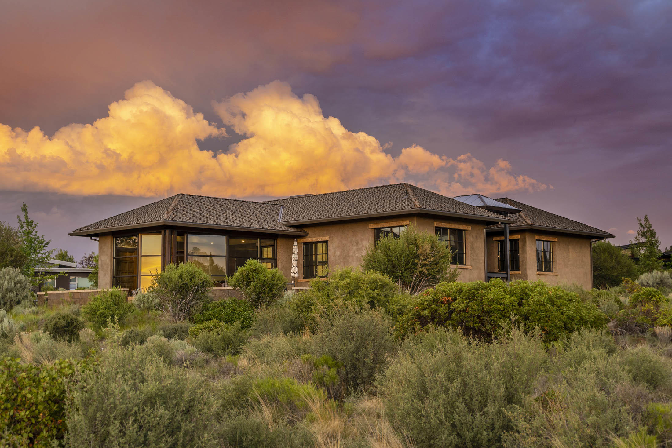 Artfully designed to maximize 180 degree mountain views, set against the majestic backdrop of Shevlin Park and the
Deschutes National Forest beyond, this Rosewood home is both unique and exceptional. Here, a rounded scheer wall,
enclosed courtyard, and west-facing glass-enclosed dining room evoke a European flair and a main level lifestyle. In the dining room you will find a wall of windows overlooking all the cascade mountains with an additional raised seating nook great for morning sunrises. This open floor plan is great for entertaining both on the main floor and downstairs with a daylight basement setting, both floors include wet bars, extensive storage and wired surround sound for all occasions. This exquisite home offers seamless granite countertops throughout, pecan wood flooring, vertical grain fir doors,
heated flooring, 3 heated zones for all season comfort, an additional office & flex space, all surrounding a beautiful courtyard with fountain.