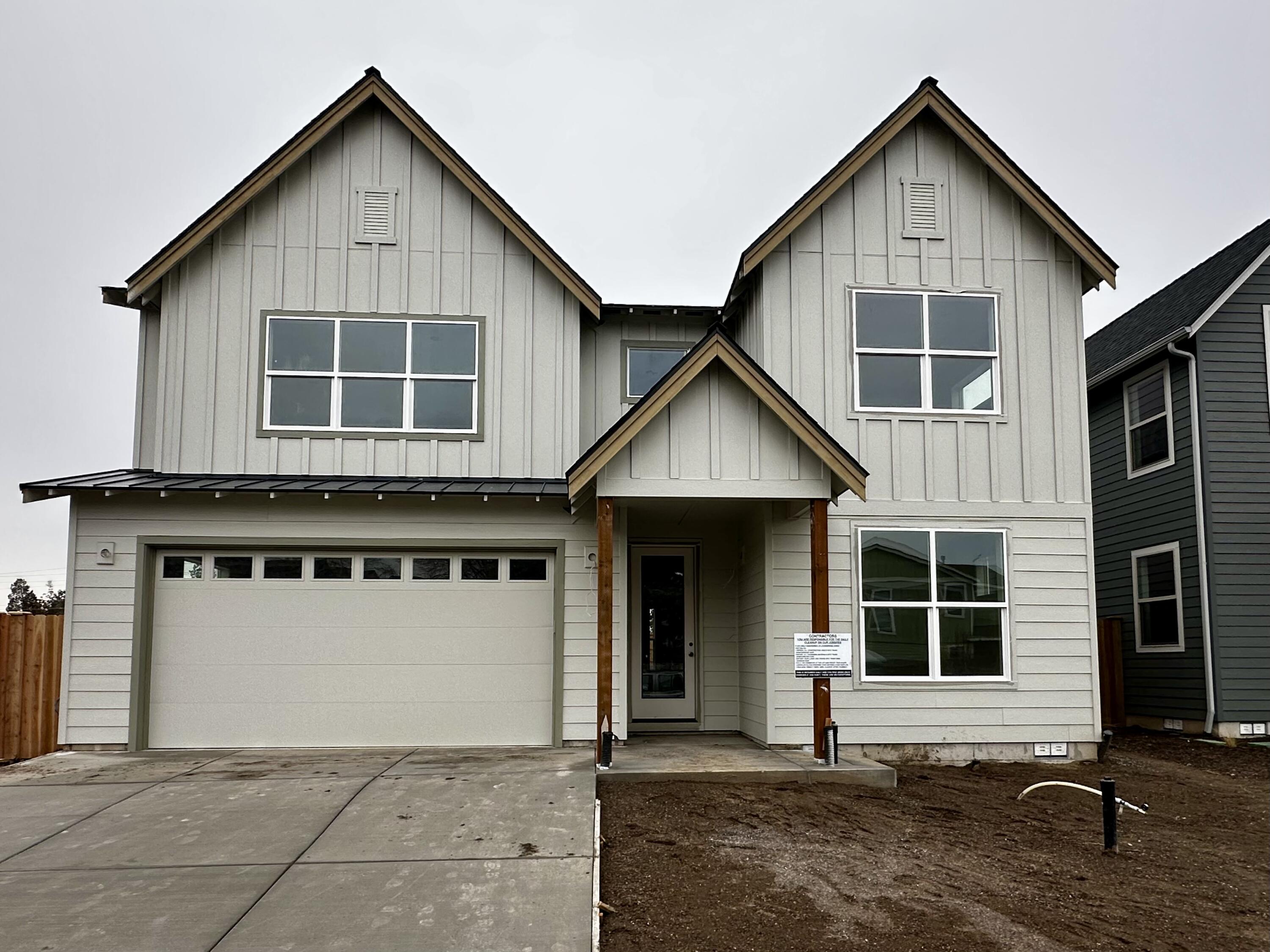 Discover modern living in Starview, SW Redmond's new neighborhood by Stone Bridge Homes NW. This thoughtfully designed home features an open great-room concept, perfect for gathering & entertaining. The kitchen shines with a central island, solid-surface counters, spacious pantry, while the dining area opens to a covered patio & fenced & landscaped backyard. A versatile main-level den or bedroom & half bath add flexibility. Upstairs, the primary suite offers a walk-in closet, dual vanities, and custom-tiled shower. 3 additional bedrooms, full bath with dual vanities, & convenient utility room complete the upper level. The three-car tandem garage provides plenty of storage & parking. With timeless finishes, functional layout, & prime location near Hwy 97, Redmond's shops, school, & dining - & just minutes to Bend-this home is the perfect blend of style, comfort, and convenience.