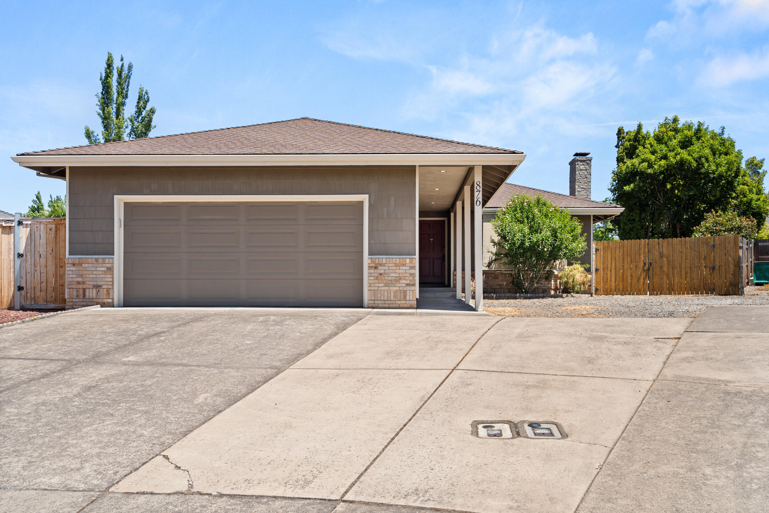 Tucked at the end of a quiet cul-de-sac in a sought-after East Medford school district, this 3 bed, 2 bath home is move-in ready with fresh interior/exterior paint and brand-new carpet throughout. The sunken living room features a cozy fireplace, while the separate family room opens to the backyard through a sliding door—perfect for entertaining. The oversized yard offers plenty of room to play, garden, or just relax, plus there's massive gated RV parking tucked securely behind the fence. Great layout, great lot, and a location that's hard to beat!