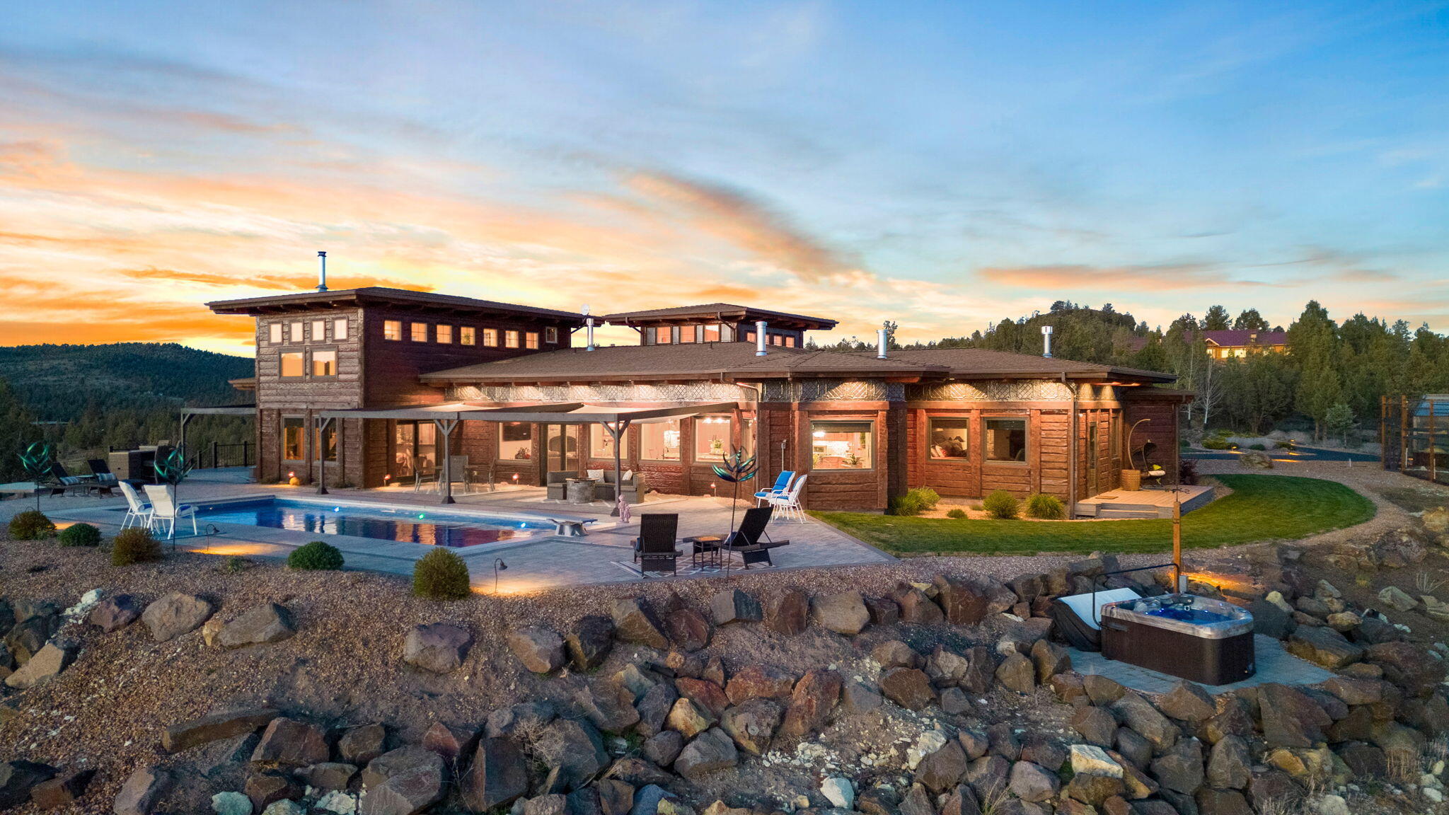 Neslted atop a scenic hillside, this custom estate offers panoramic views of the cascade mountains, lush valleys, and breathtaking sunsets. Step into luxury and embrace
relaxation with an in-ground pool, bubbling hot tub, & sauna. This exquisite home features 4 primary bedrooms, each w/incredible on-suites w/heated tile floors, heated
towel racks, tiled walk-in showers, & custom vanities w/granite counters. Incredible chef's kitchen w/2 built in Bosch Dishwasher, subzero refrigerator that blends
seamlessly w/the wood cabinets. Commercial wolf range w/cooktop, griddle, oven, and warming drawers. Second cooktop w/searing unit. Walls of windows w/custom
blind. Study/Family room w/custom bar w/temperature controlled wine cellar, drink fridge, ice maker, & dishwasher. Crows nest loft with 360* windows. Built in vacuum
system, 2 furnaces & heat pumps for the ultimate comfort. Complete privacy with 13.46 acres of land. Call today for your private tour.