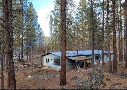 Amazing opportunity at an incredible price for the person who wants off the road, quiet, privacy and peace! Serene 5 acres among the Ponderosa Pines, rich in local wildlife and ready to rehab or build new your way! Possibly some merchantable timber. Seller is very motivated and will look at any reasonable offer.