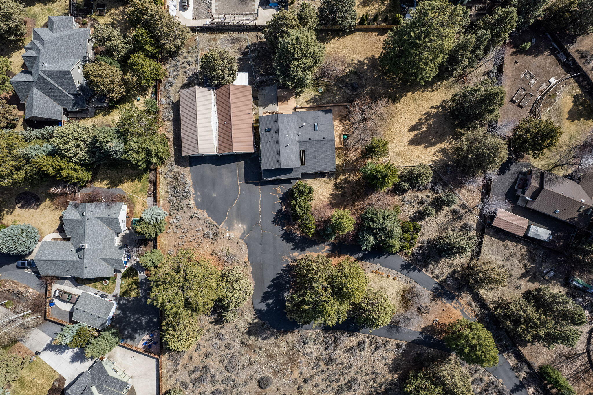 Experience a slice of country right in town! Check out this home which offers tremendous value. This is a special property which abuts the popular Mt. Vista neighborhood and is on 2.63 acres. A rare find in town!  A private and quiet oasis in a serene park-like setting surrounded by lush landscaping & deciduous & apple trees !  The eclectic 2 story farmhouse style home has 2872 sq ft of casual living space with 4-5 BR, an office and 3 Bath.  Additionally, there is a finished, detached structure hosting a finished 809 sq ft recreation/bonus room w full bath PLUS a 4 car garage including RV space & workshop. Seller does not think Bathroom in the rec room is permitted. Possibilities galore for those seeking a family compound, home business space,  guest suite, car enthusiasts, art studio/hobbyist. Property has no HOA and is RL zoned. Investors may find it attractive for the potential for future development!   Fantastic value - recently appraised at $1.4 and now offer $995,000. Seller is
